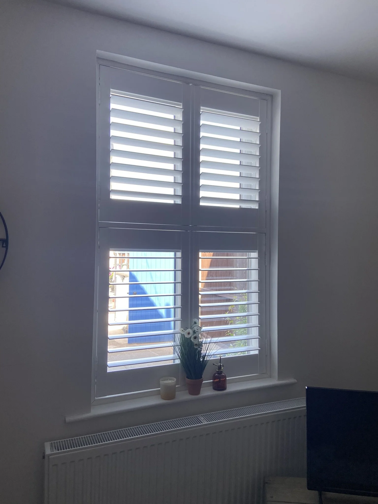 Tier-on-Tier Shutters fitted to a lounge in Lowton