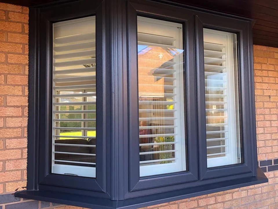 UK-made PVC shutters fitted to a Lounge bay window in Culcheth