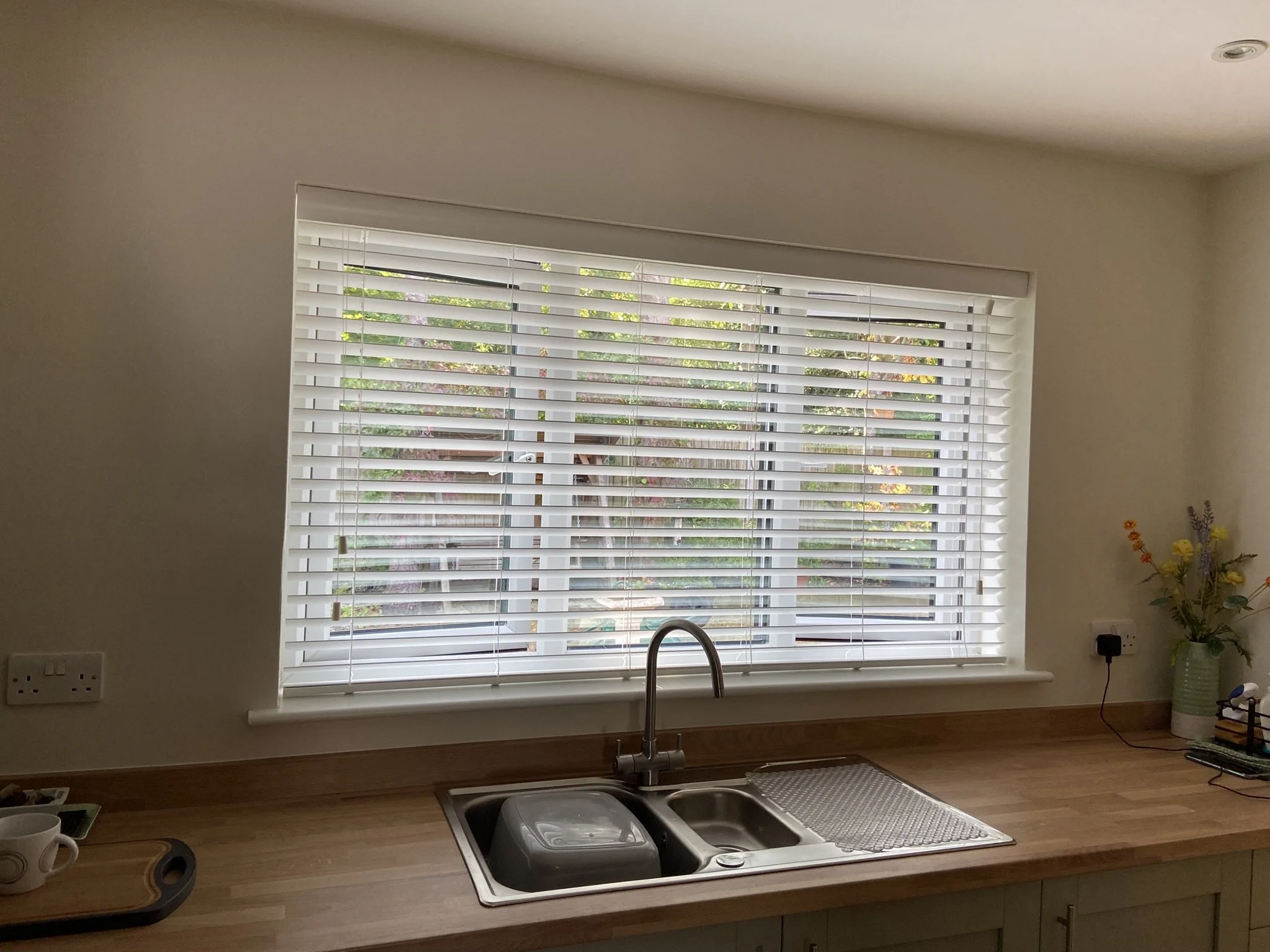 White Wooded blind fitted in a kitchen in Leigh