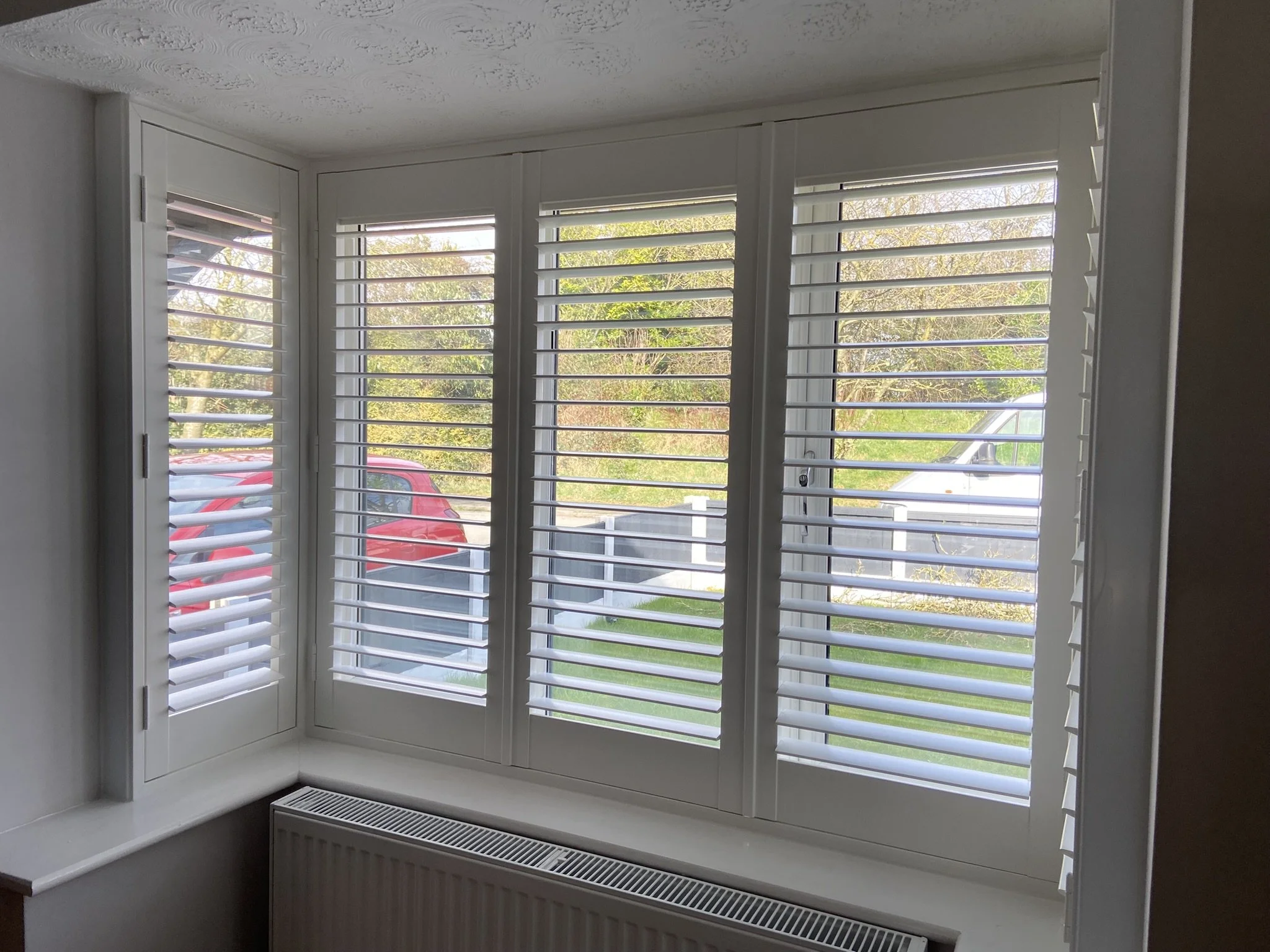 Shutters fitted to a bay window in Lowton