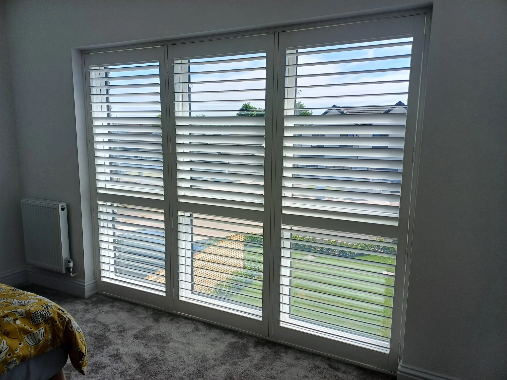 Hardwood Shutters in a Bedroom in Culcheth