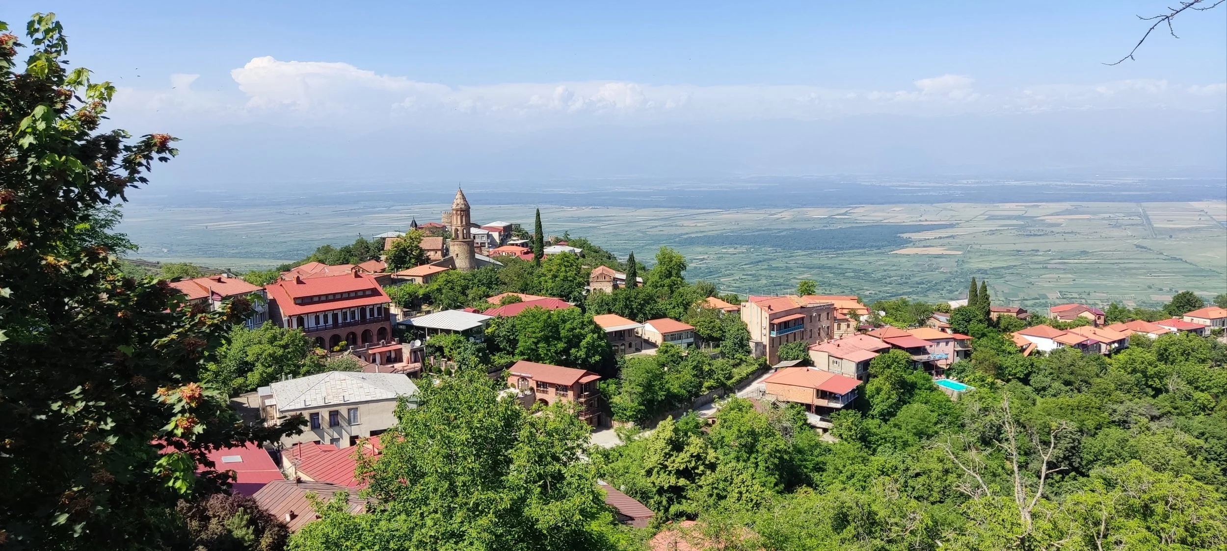 Sighnaghi hilltop village with red-tiled roofs overlooking Alazani Valley in Kakheti — private East Georgia tour