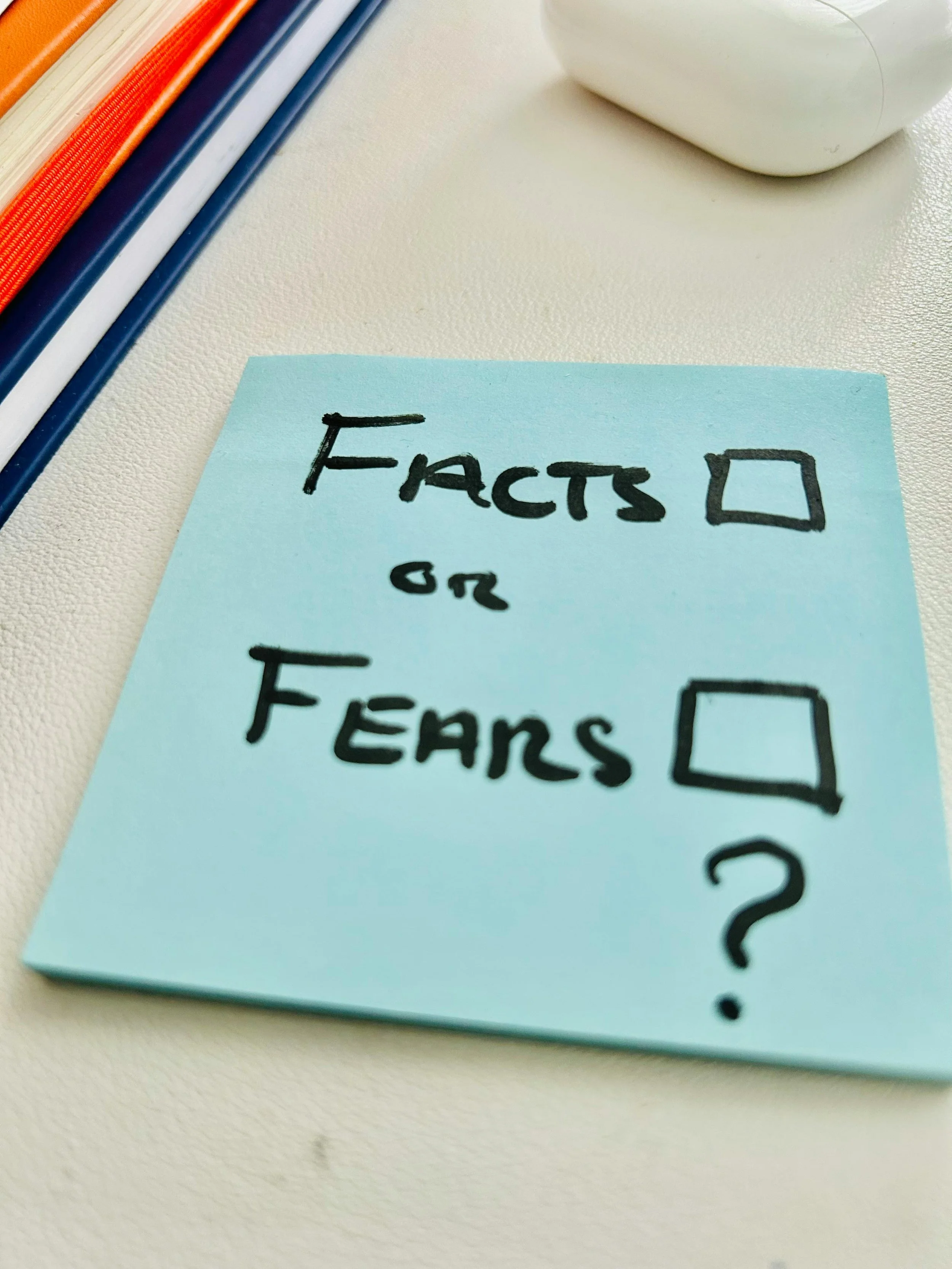 Sticky note with check boxes depicting facts or fears - psychology of overthinking and understanding rationale and logic behind anxiety.