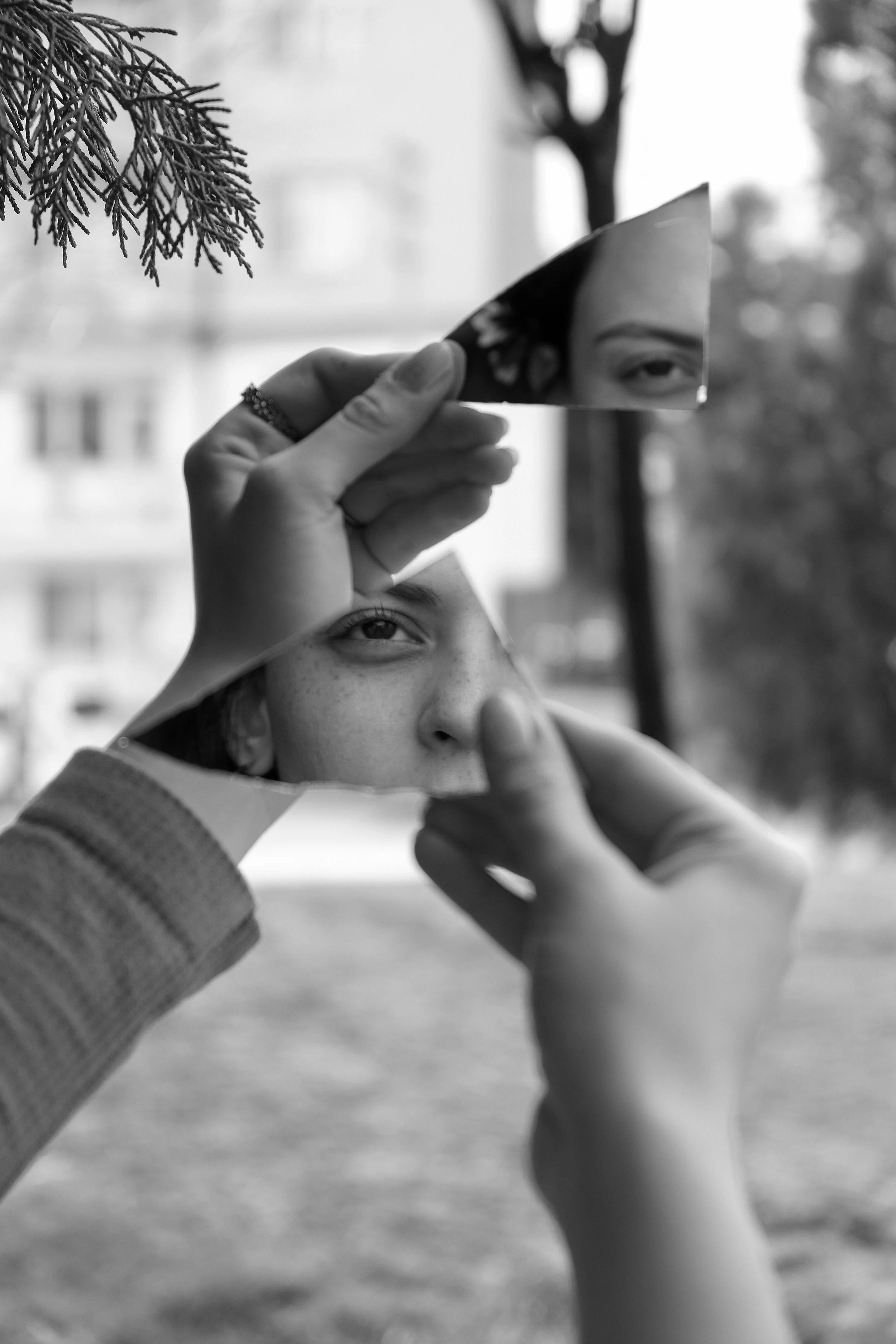 the divided self concept with jungian psychology for becoming on point in black and white with a womans face divided into two mirror pieces