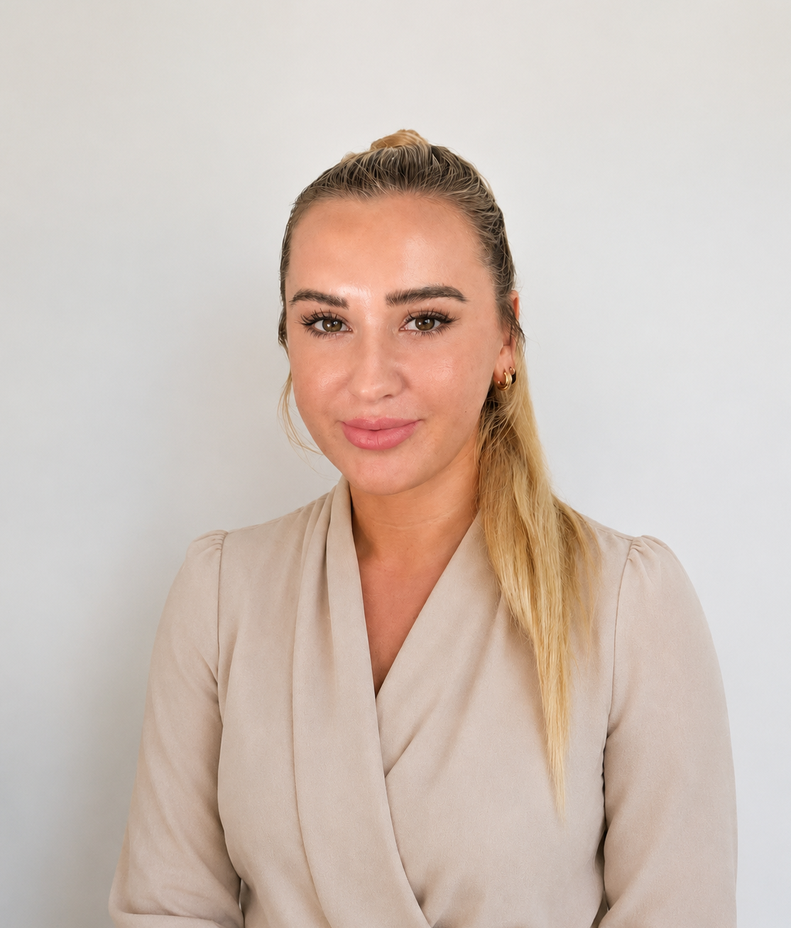 portrait shot of woman, Gabrielle wearing beige and hair up for becoming on point and tyho