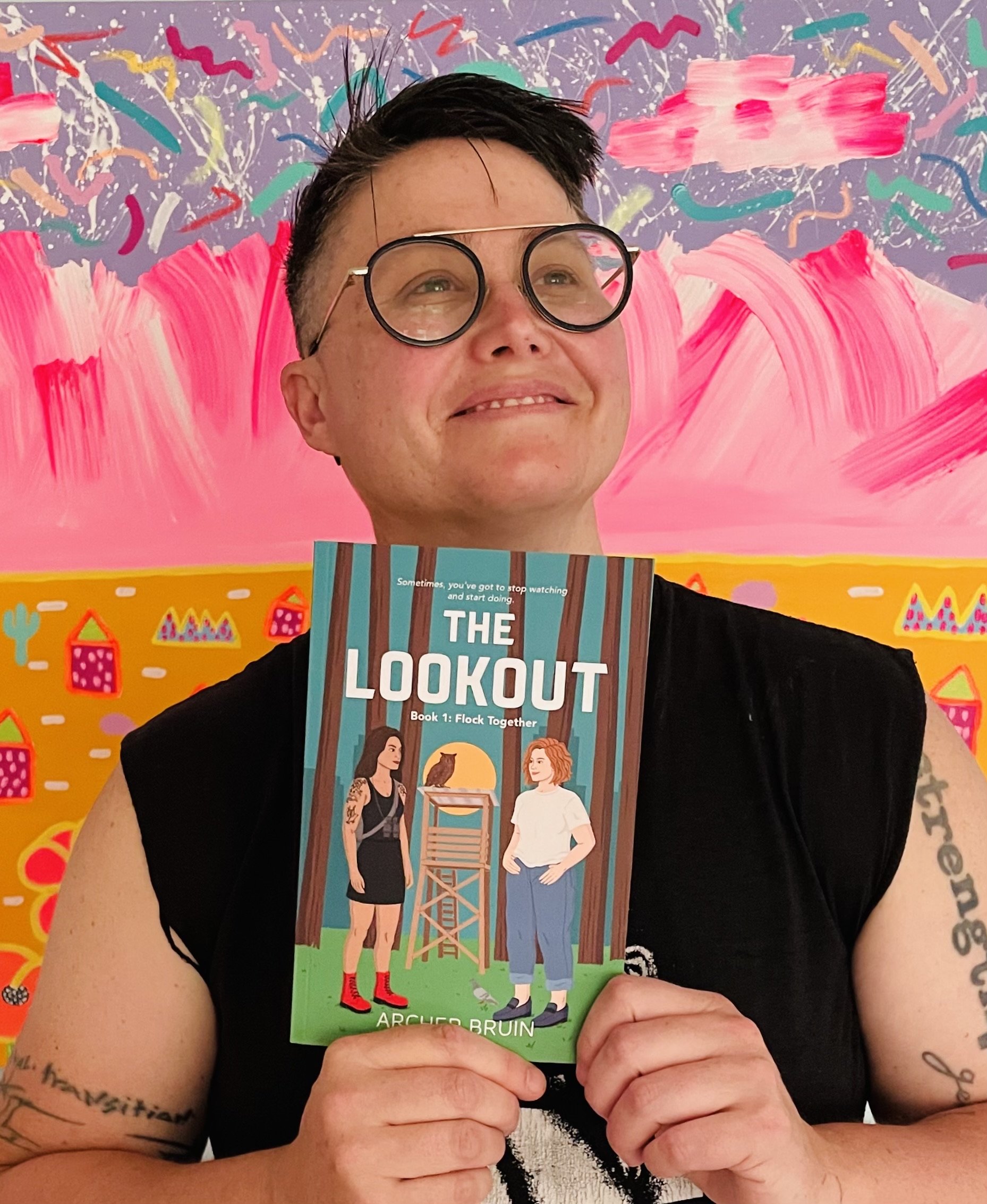 Archer bruin holding the lookout book