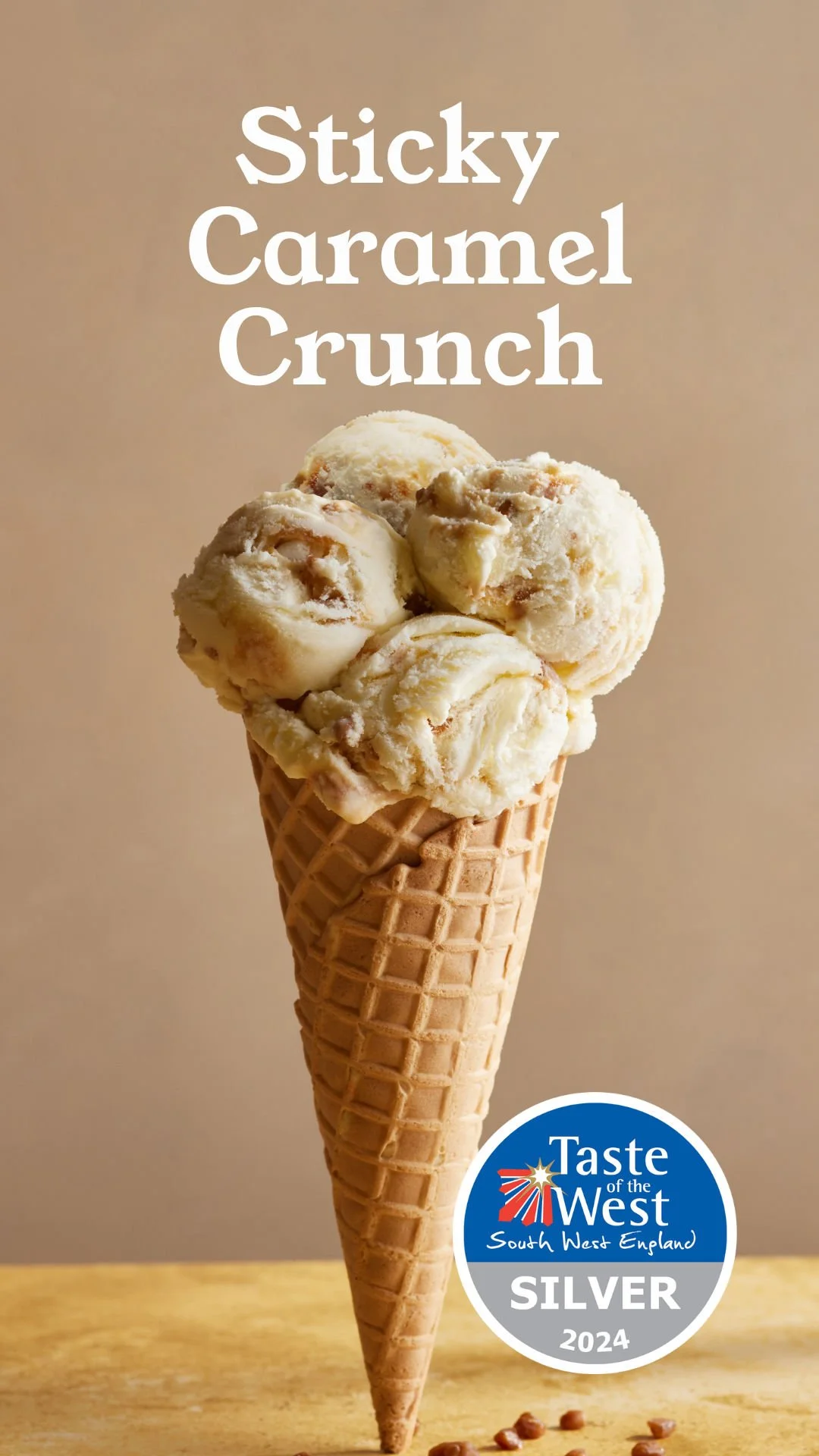 Ice cream cone with four scoops of sticky caramel crunch ice cream, displayed with a Taste of the West South West England Silver 2024 award badge.
