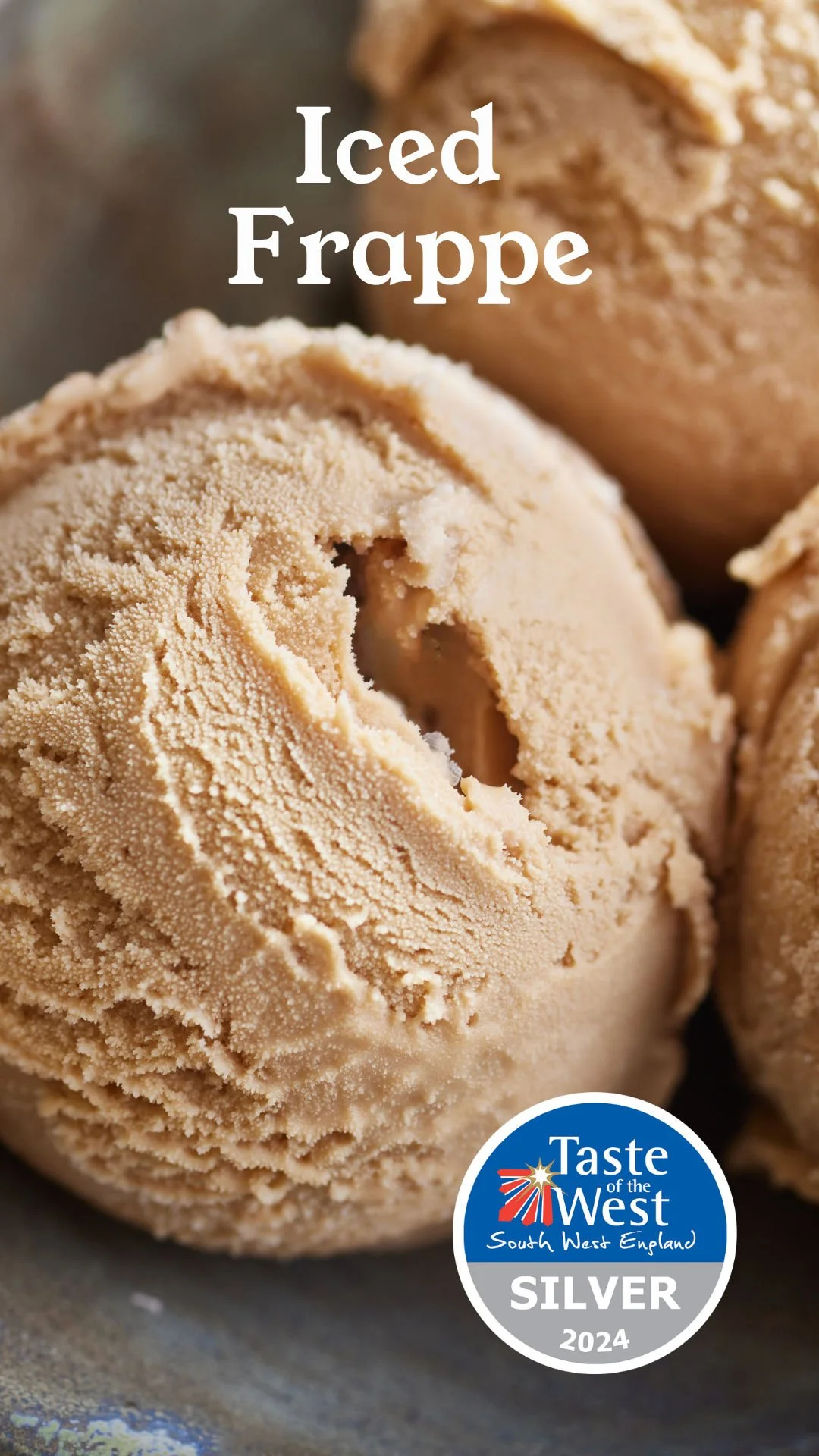 Close-up of a scoop of beige ice cream with a bite taken out, with other scoops in the background, and a 'Taste of the West South West England Silver 2024' award badge in the bottom right corner.