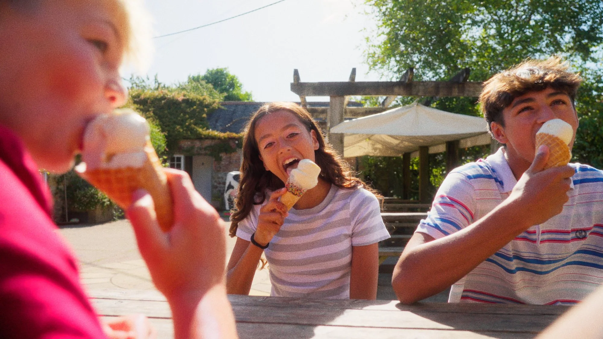 A family enjoying Cornish ice cream at Callestick Ice Cream Parlour