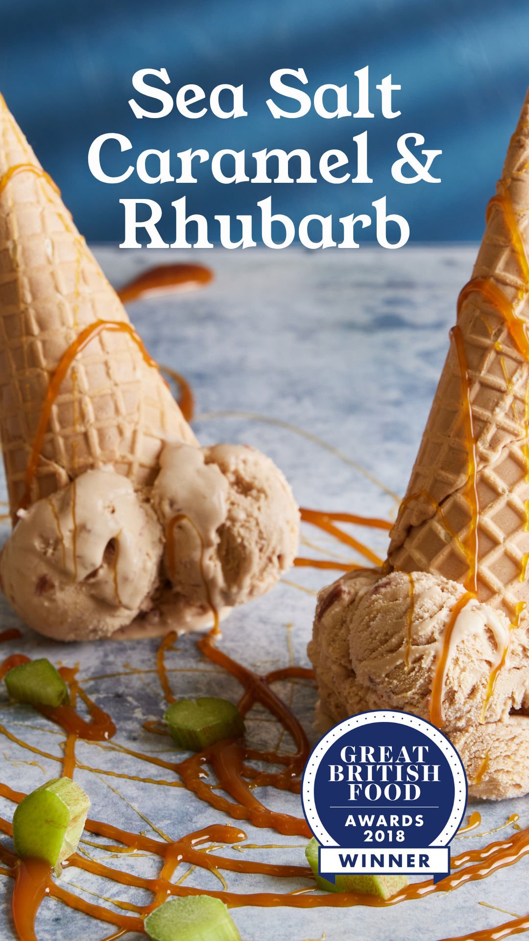 Ice cream cones with caramel and rhubarb, and scoops of ice cream topped with caramel, on a dessert display with a "Great British Food Awards 2018 Winner" badge.