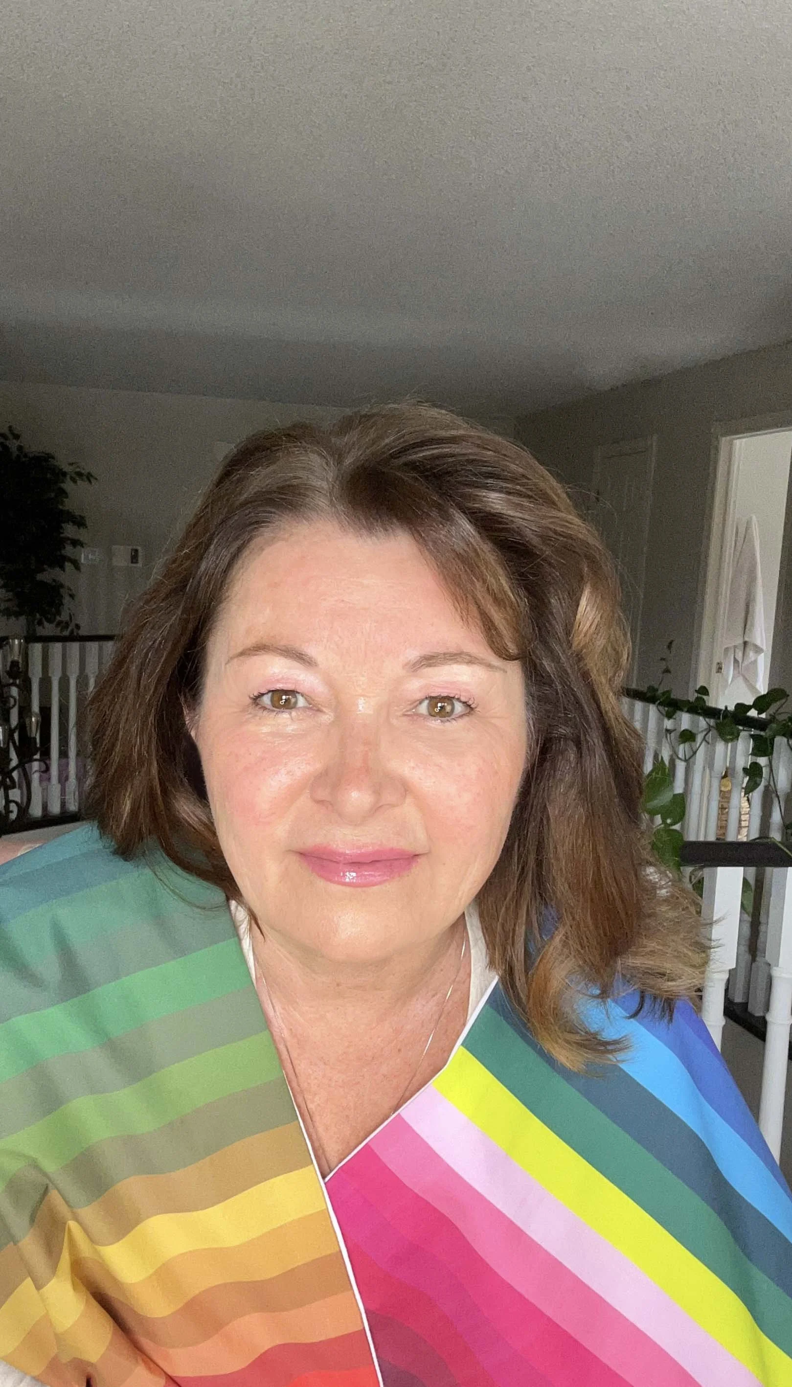 Linda draped in LINLEE Colour Analysis flags looking forward to meeting you! 
