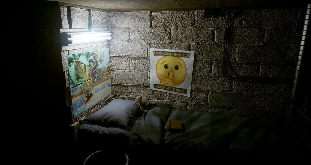 A still of a poster in a dimly lit basement. It reads "God can hear you, make no sound".