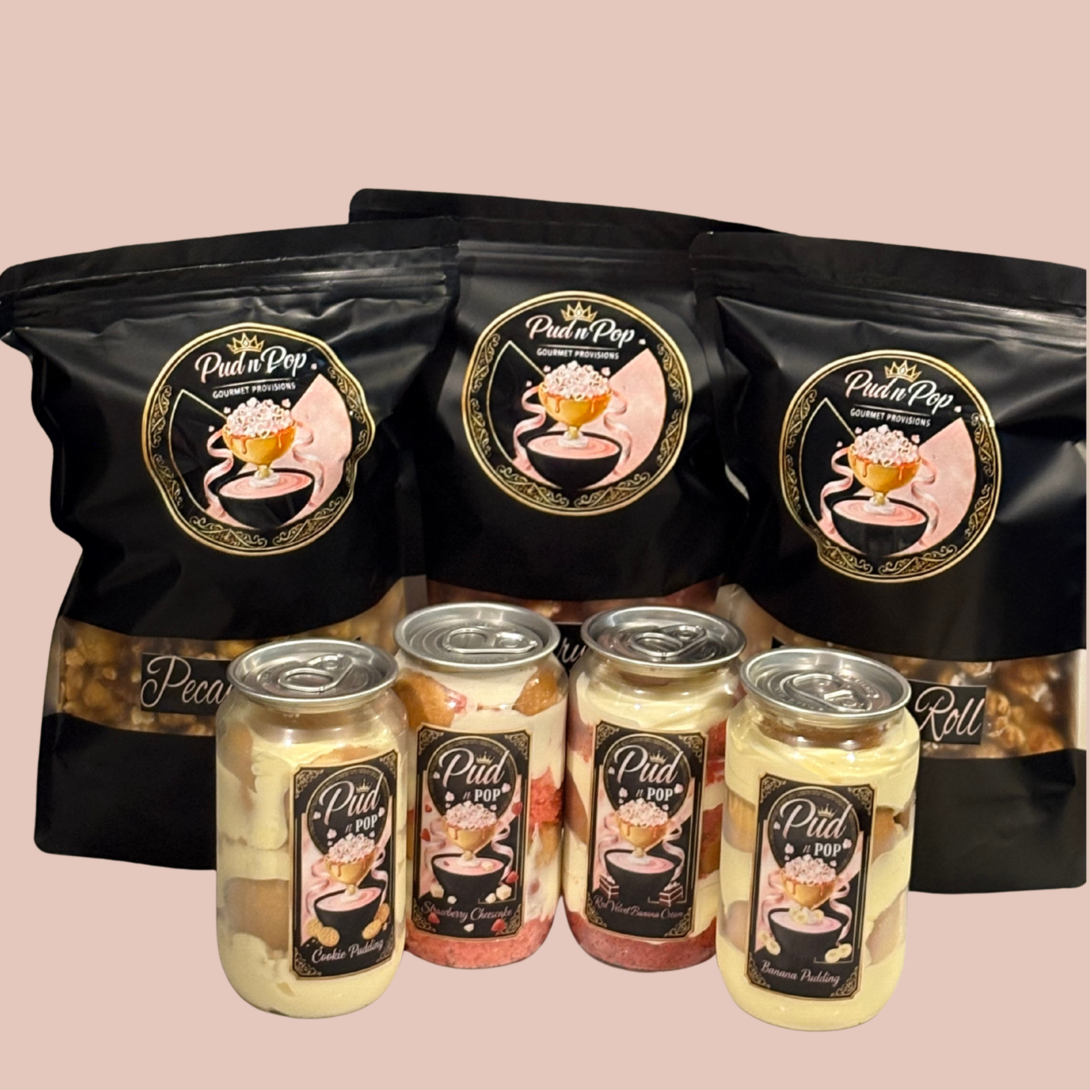 Packages of pudding and small cans of pudding with black labels and images of pudding cups on a beige background.