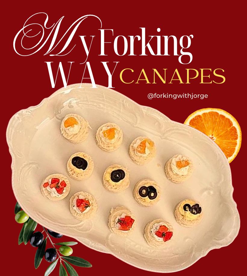 A white decorative platter with small canapes topped with various toppings, including black and red olives, and orange slices, orange half on the side, with a red background and herbal garnish, and text that reads "My Forking Way CANAPES".