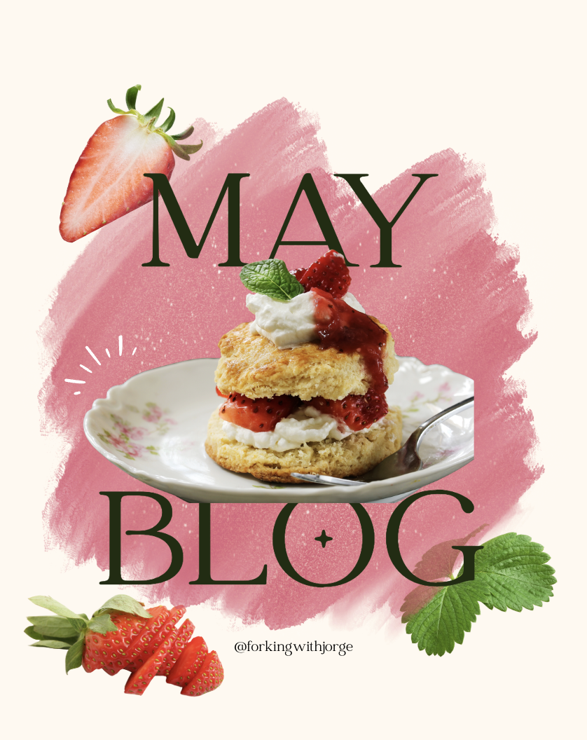 A promotional image for a May blog featuring a plate with strawberry shortcake, strawberries, and mint leaves, with a pink brushstroke background and strawberries and mint leaves decorated around.