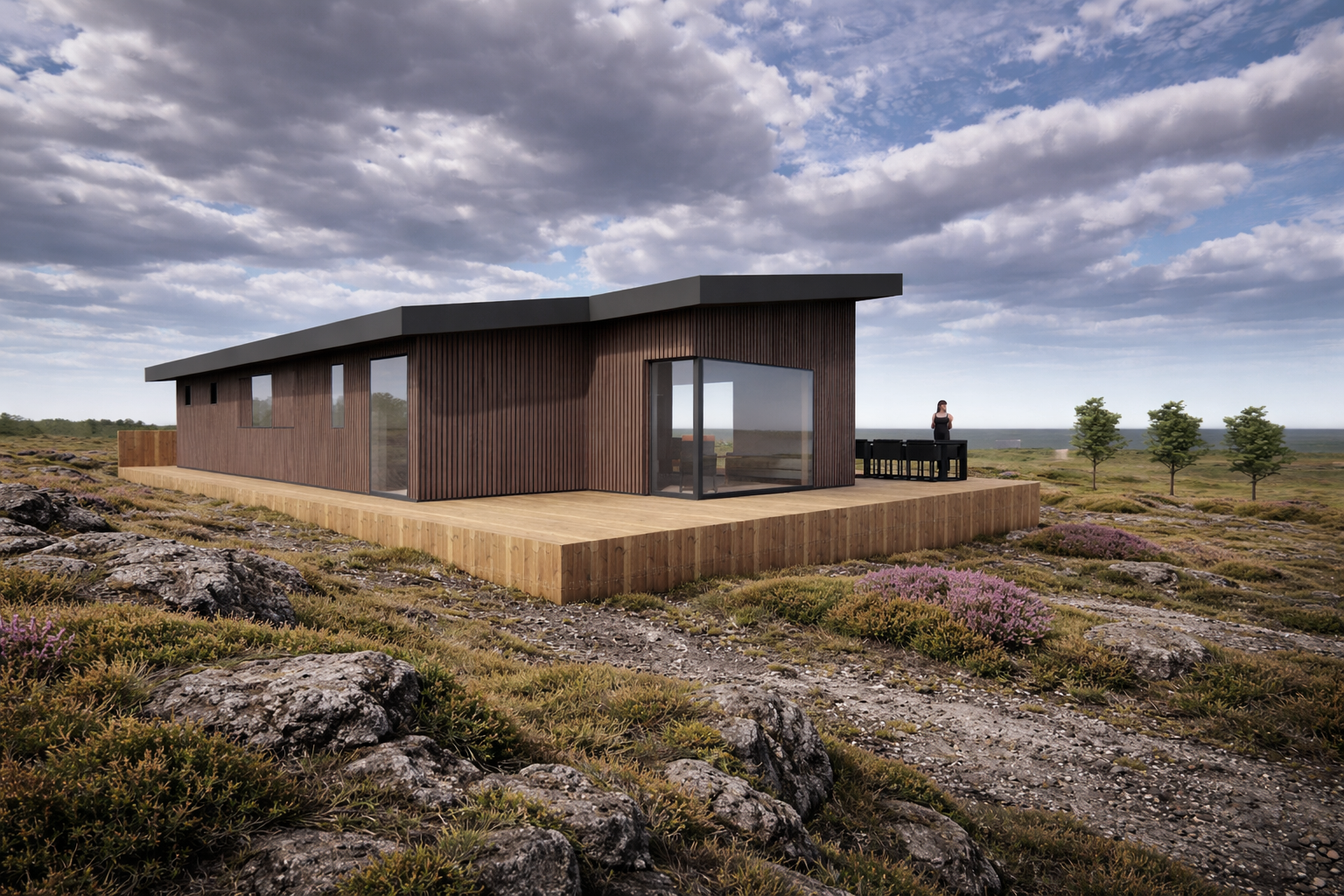 Modern wooden house on a raised deck in a rocky, open landscape with trees and a cloudy sky.