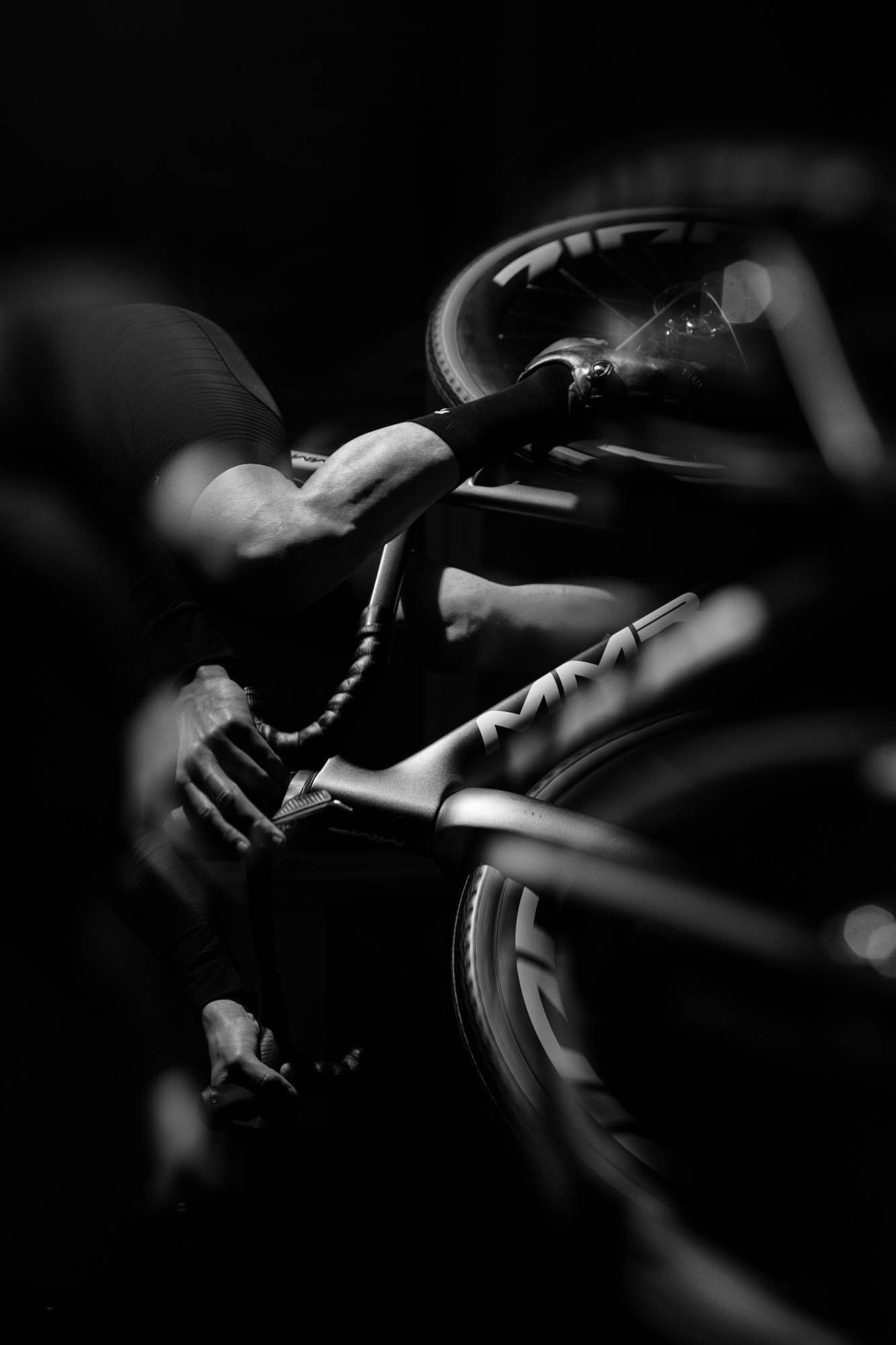 Black and white photo of a bicycle and rider shot for an MMR campaign.