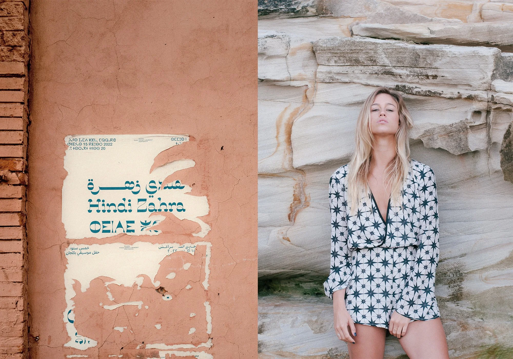 A woman with long blonde hair wearing a patterned romper standing against a layered, beige rock wall on the right side of the image, and a weathered pink wall with torn posters in a foreign script on the left side.