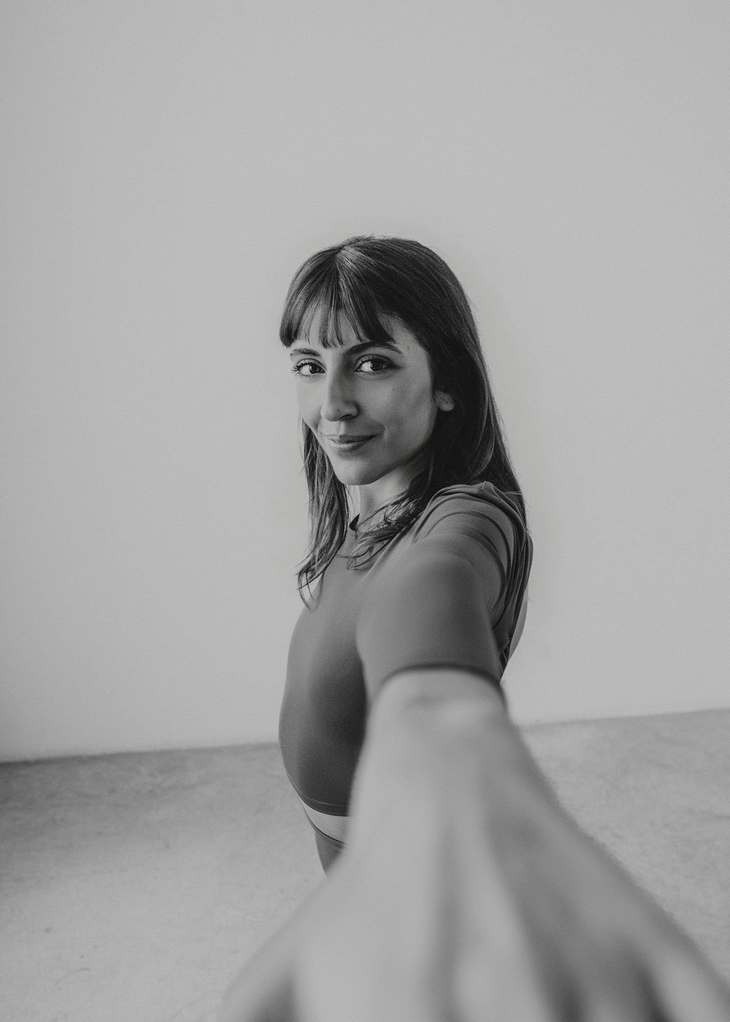 Black and white photo of a woman doing yoga as part of an advertising campaign for Allianz.