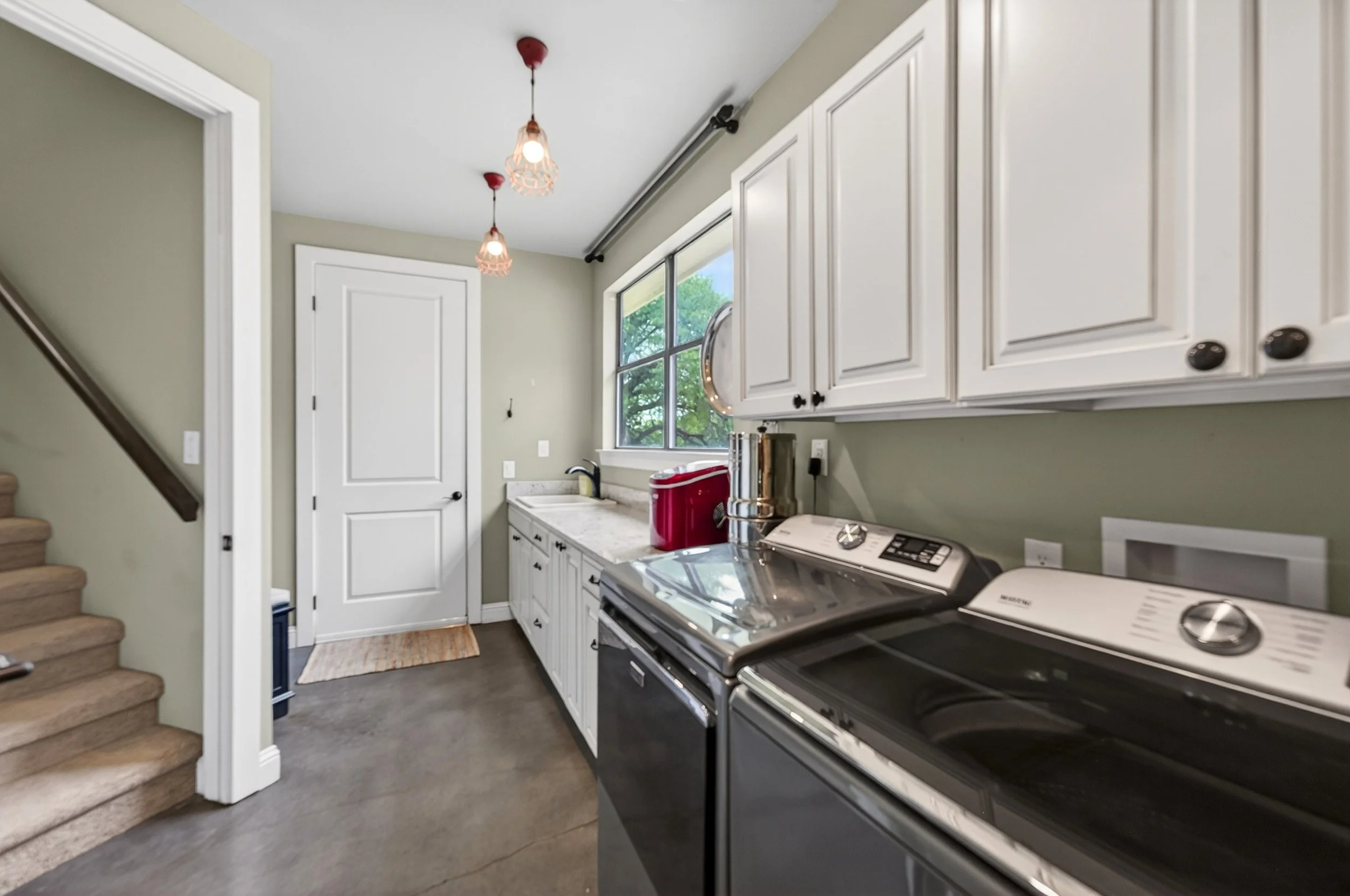 Utility with front entry view & access to bonus room.
