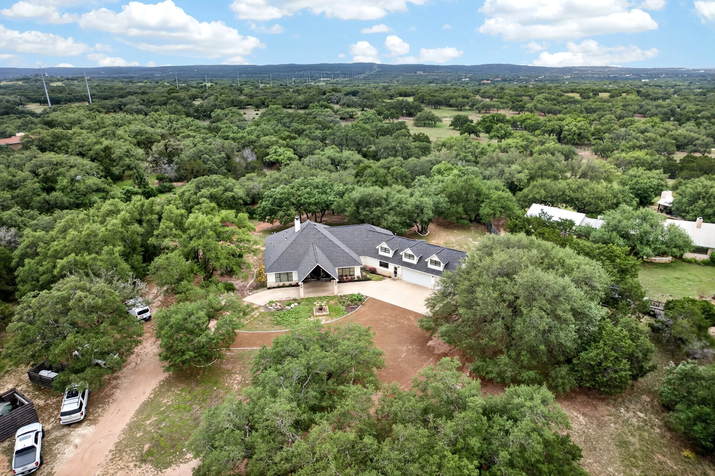 Surrounded by dozens of live oak canopies shade across the property.