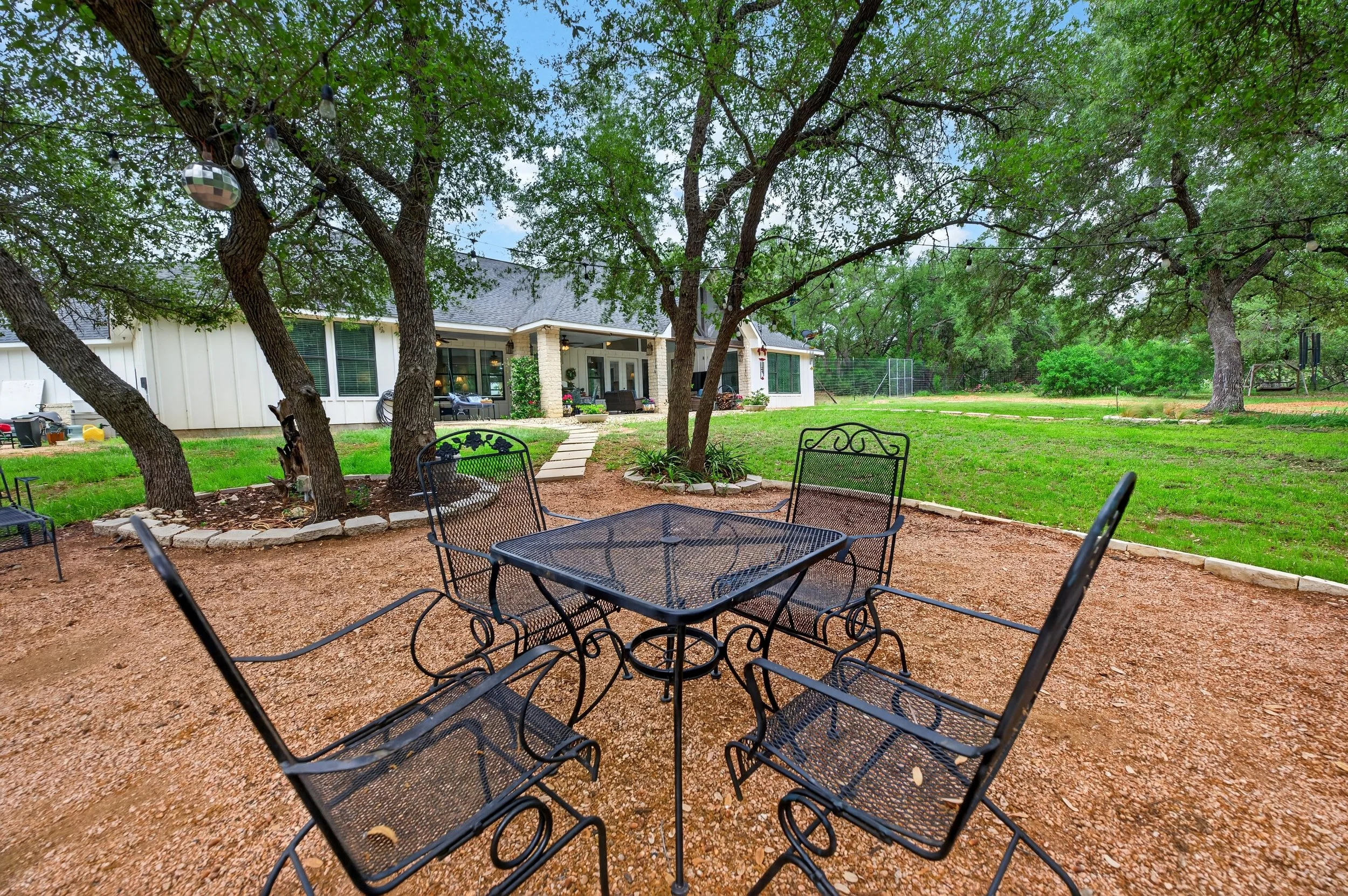 Tree covered outdoor living area.