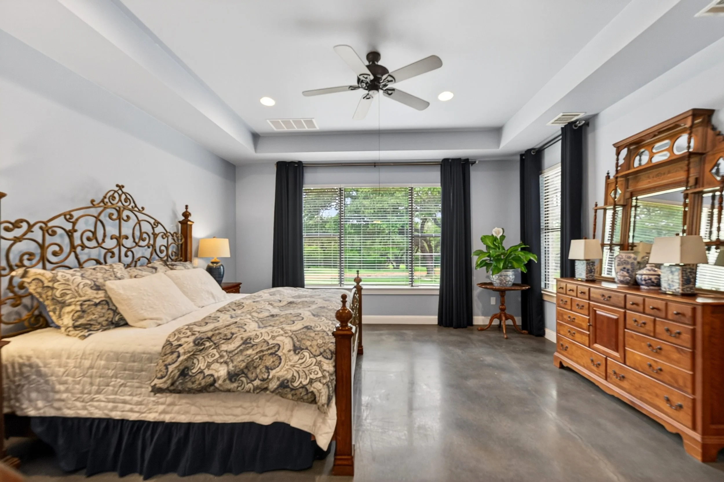 Master suite overlooks backyard.