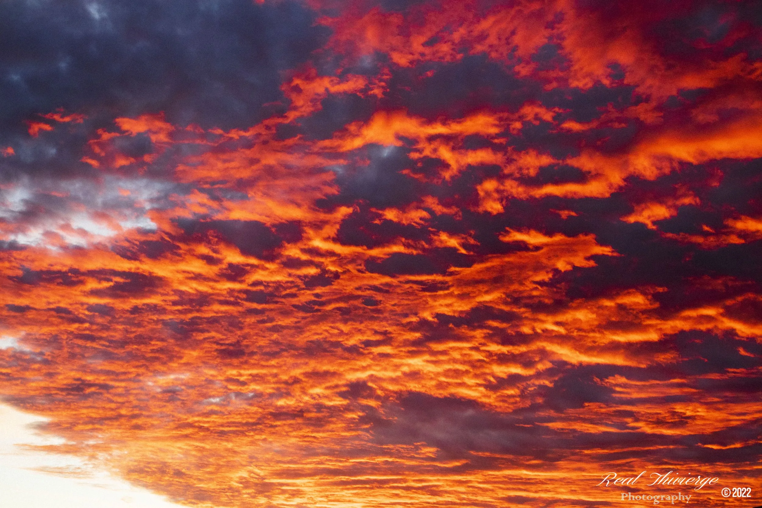 Dramatic orange and red sunset sky over Montreal, Quebec - sky and landscape photography by Tibber's Photography.