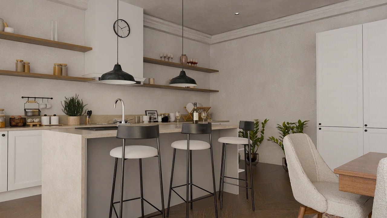 Modern kitchen with white cabinets, open wooden shelves, black hanging pendant lights, a small breakfast bar with three black and white barstools, and a dining area with beige upholstered chairs and a wooden table. Potted plants and kitchen accessories are also visible.