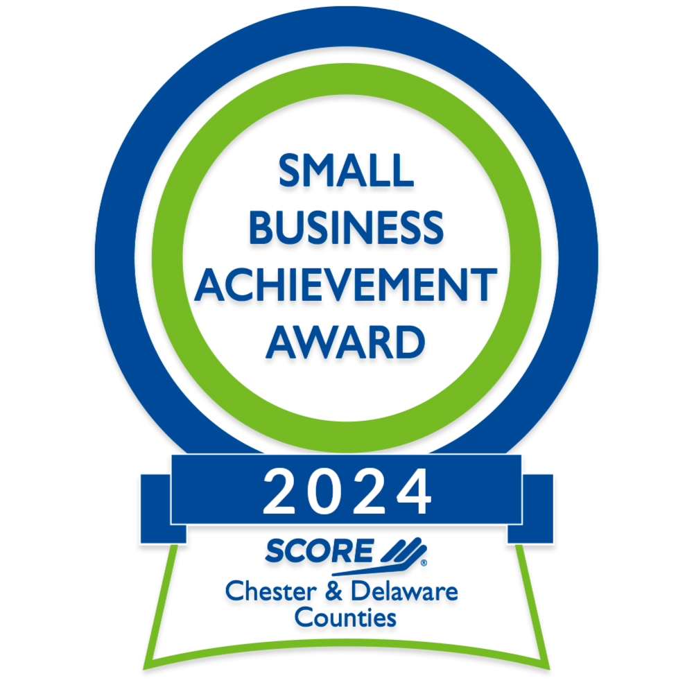 Award badge for the 2024 Small Business Achievement Award presented by SCORE for Chester and Delaware Counties.