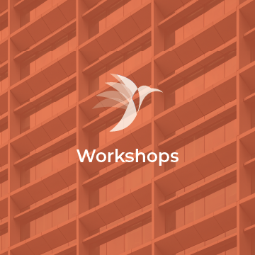 Illustration of a white bird with outstretched wings above the word 'Workshops' on a brick-patterned background.