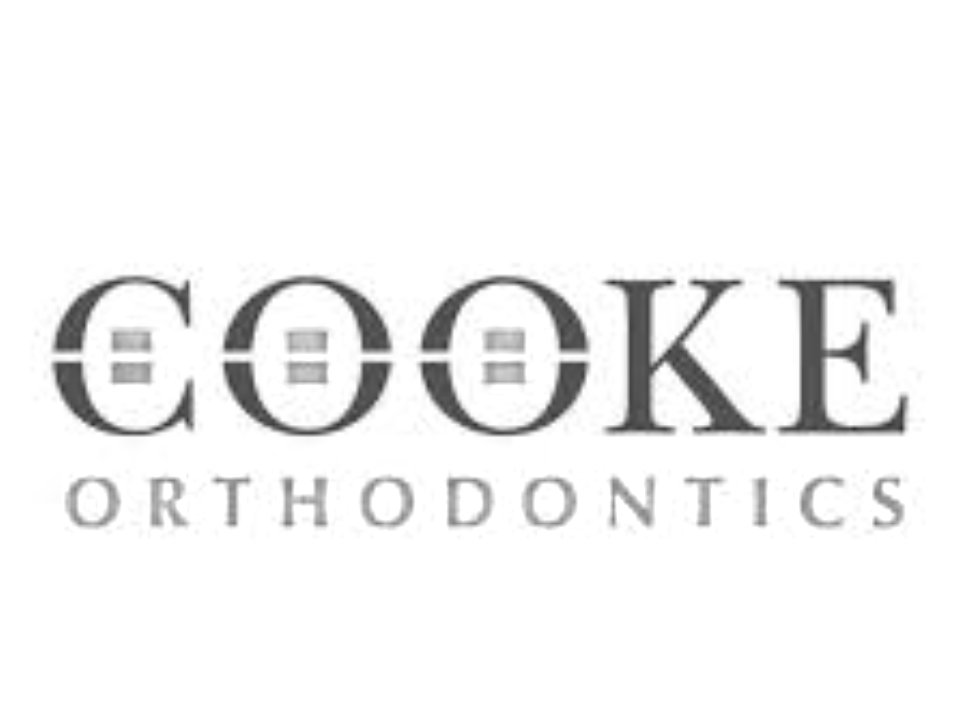 Logo for Cookie Orthodontics, featuring the word 'COOKIE' with the 'O's stylized as orthodontic brackets.
