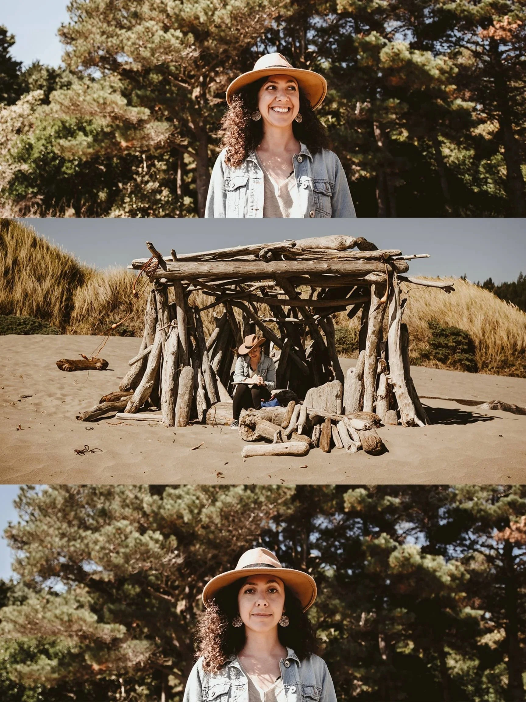 A woman wearing a wide-brimmed hat, denim jacket, and earrings smiling outdoors in a wooded area, with a driftwood hut on a sandy beach and trees in the background.