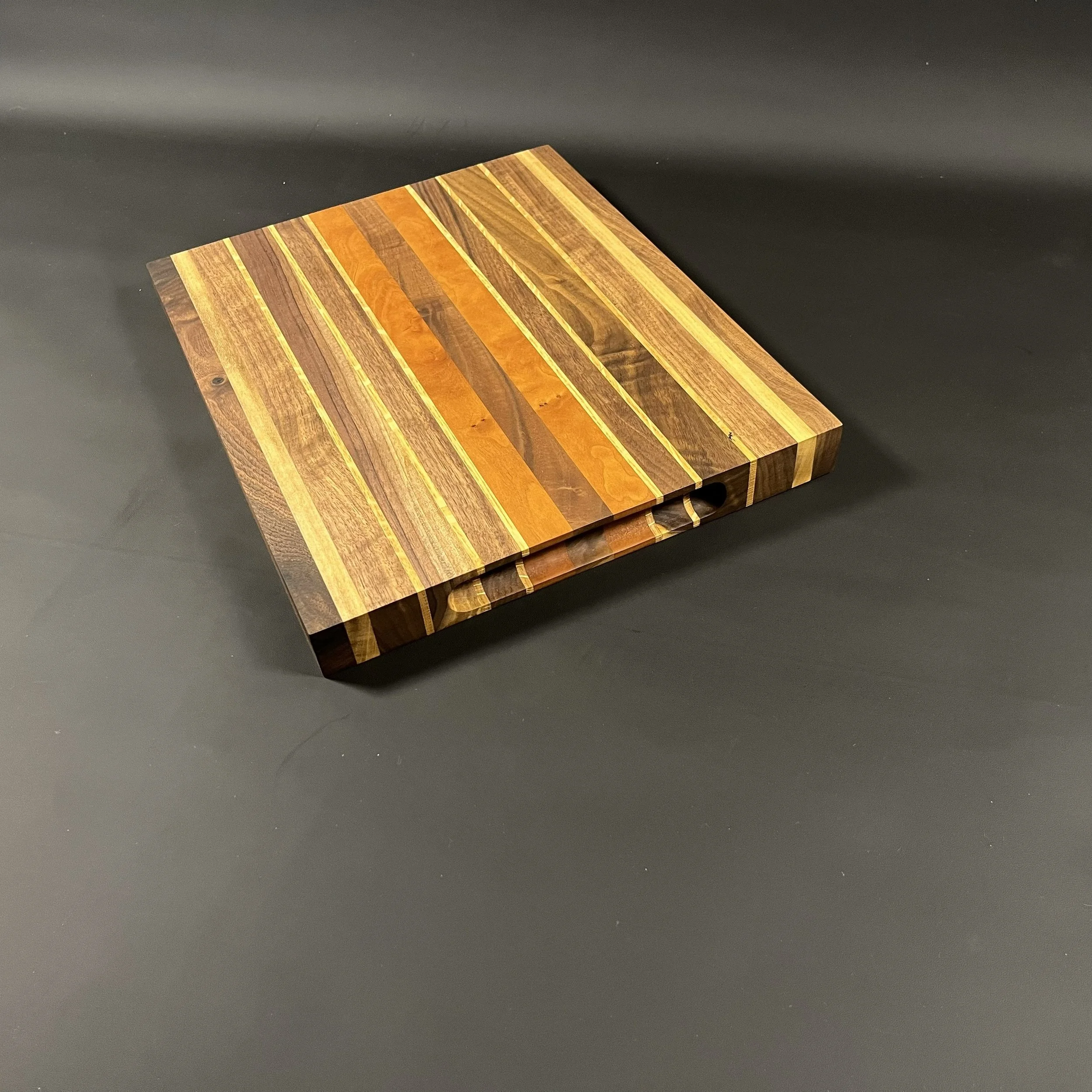 The White River cutting made of walnut with cherry and white oak accent strips.