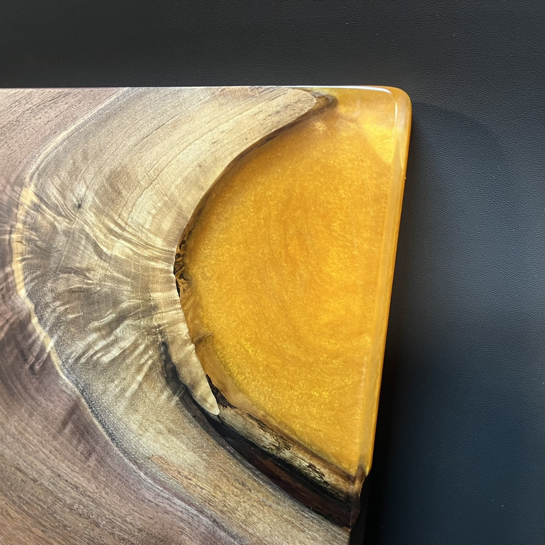 Charcuterie board with amber resin.