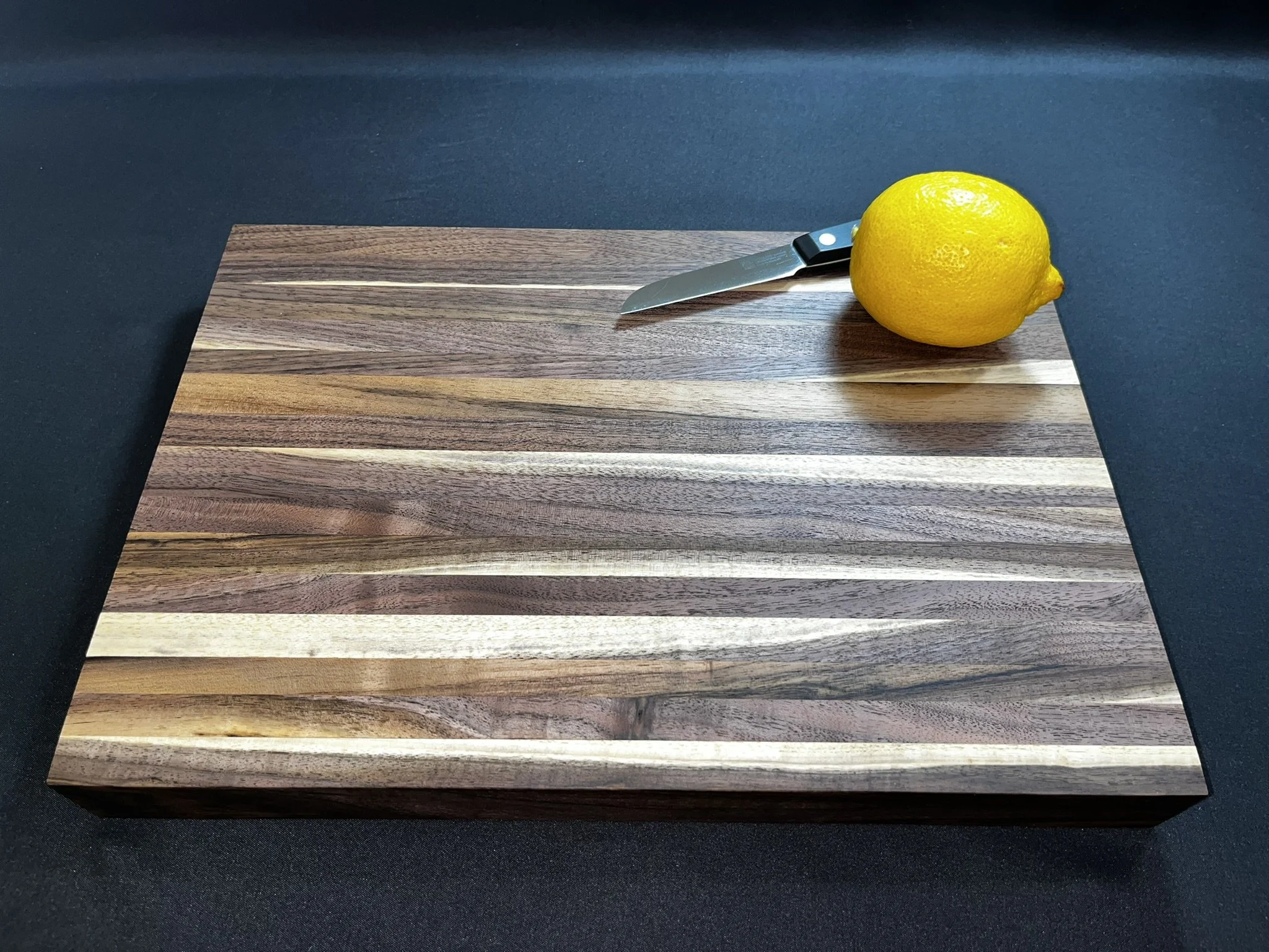 Walnut City Signature cutting board of all walnut including heartwood and sapwood.