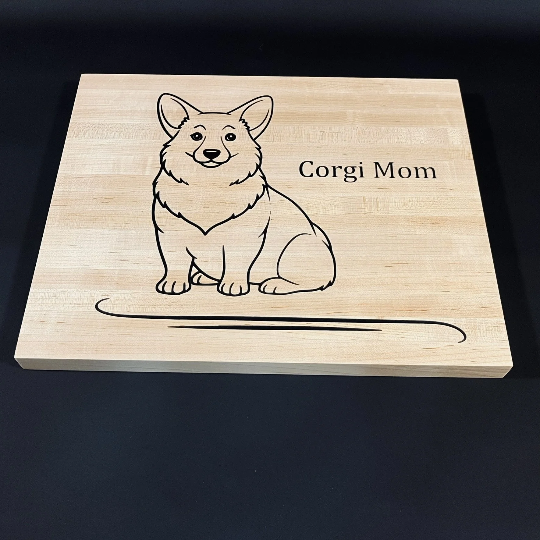 Maple board for the Corgi lover. Use the carved side for display or charcuterie board. Opposite side can be used as a cutting board.
