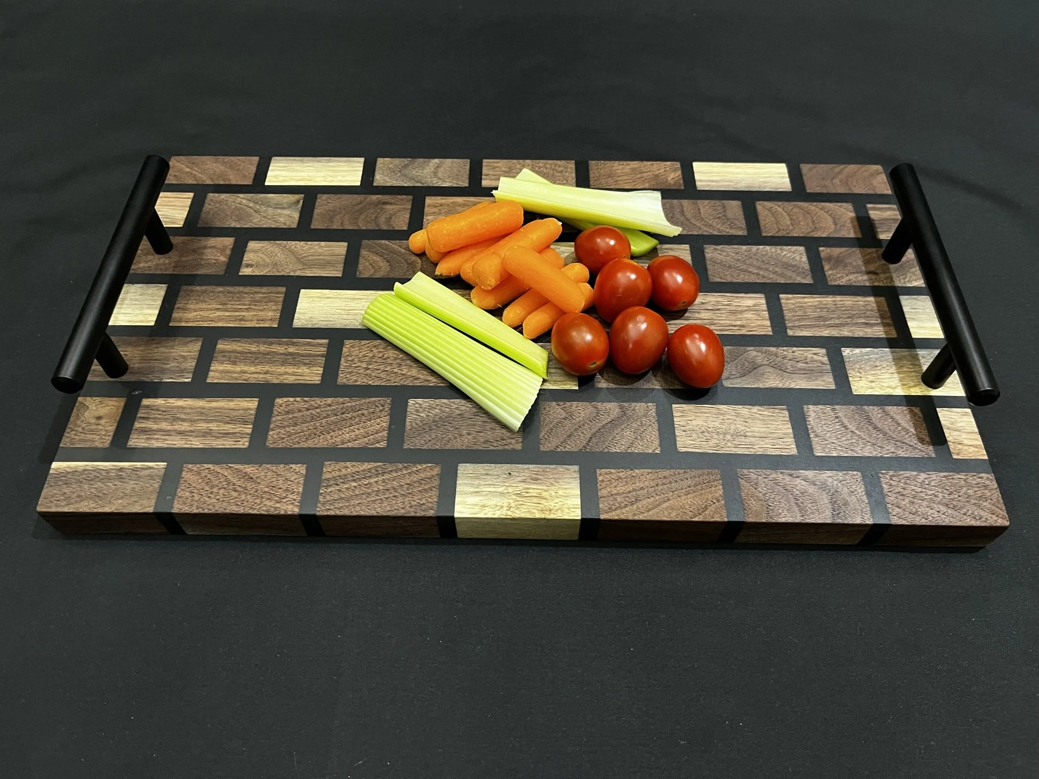 Walnut board with black epoxy grid lines.