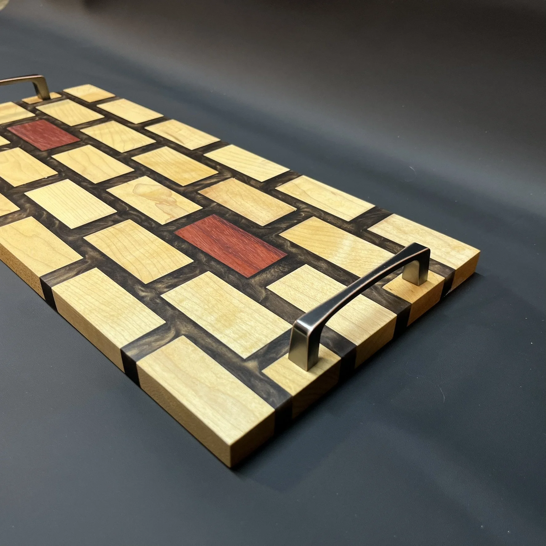 Maple with padouk and copper epoxy.