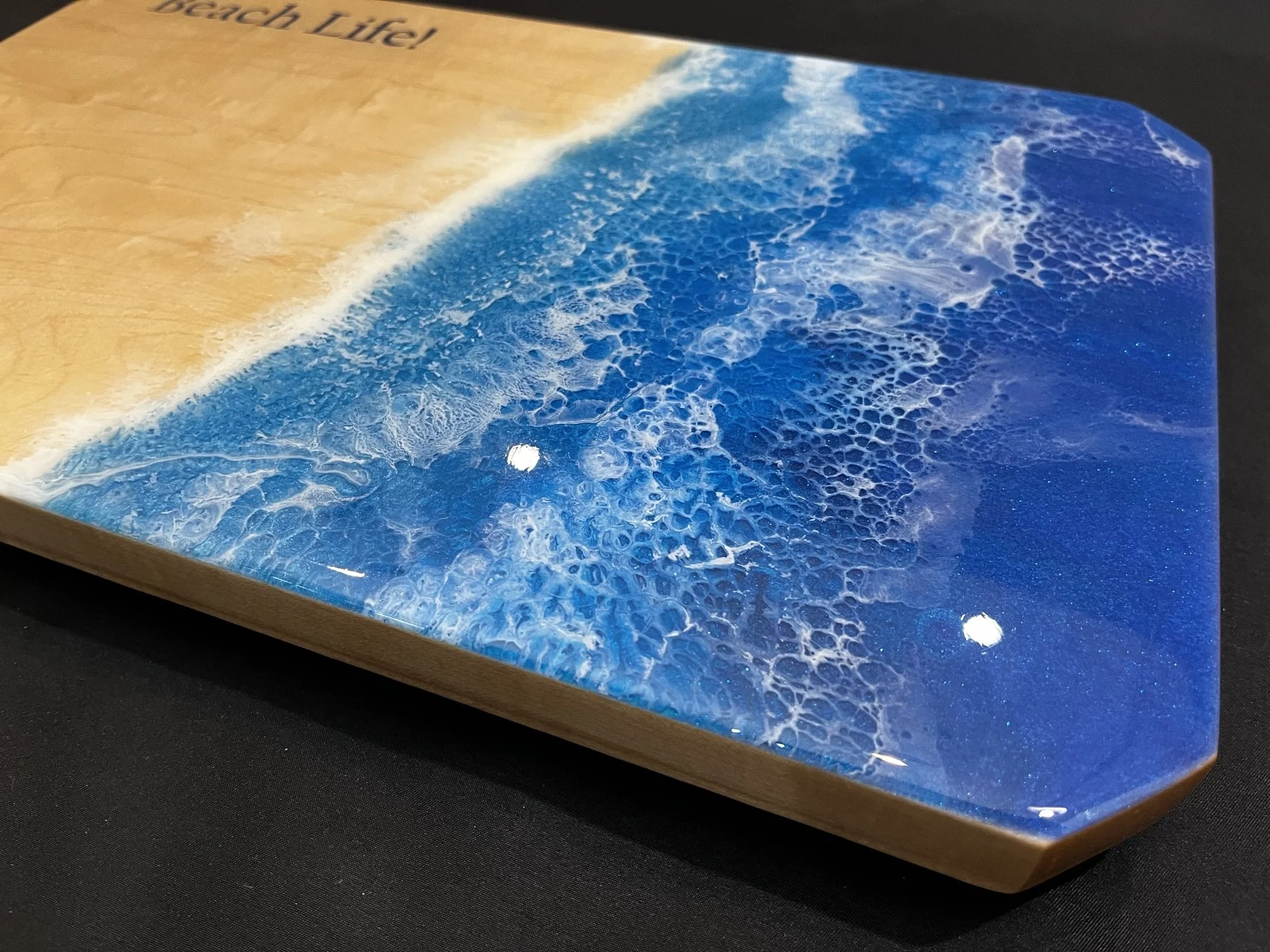 Close up of ocean and waves on beach.