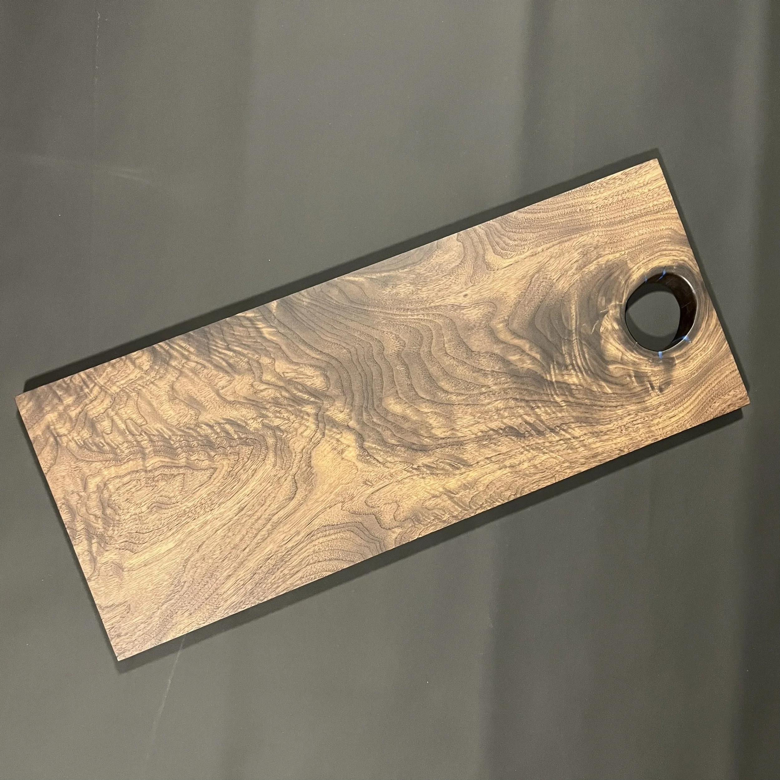 Walnut charcuterie board with gorgeous wood grain.