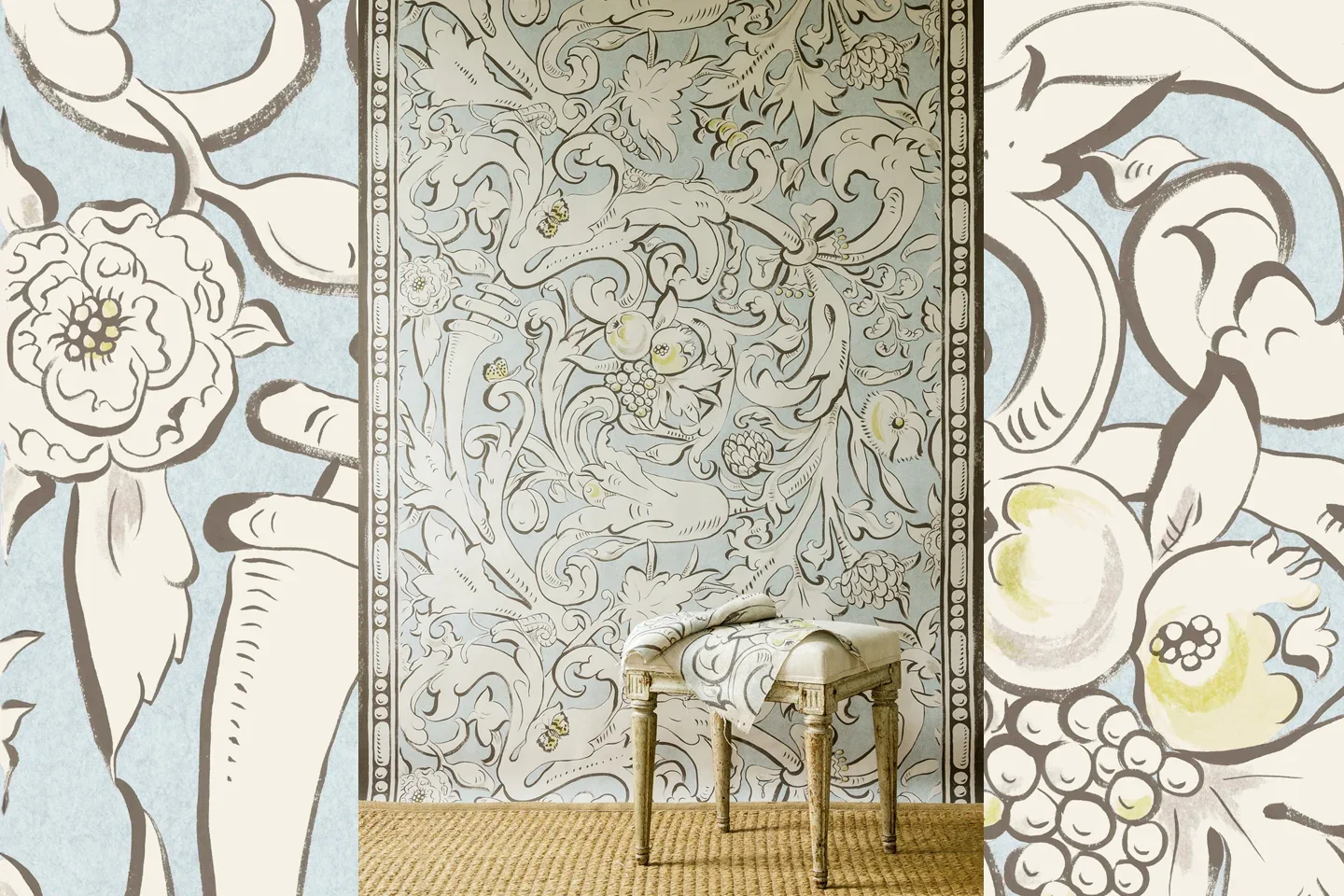 A decorated wall featuring a floral and dragon design, with a small vintage-style stool or table in front of it, partly covered with draped fabric.