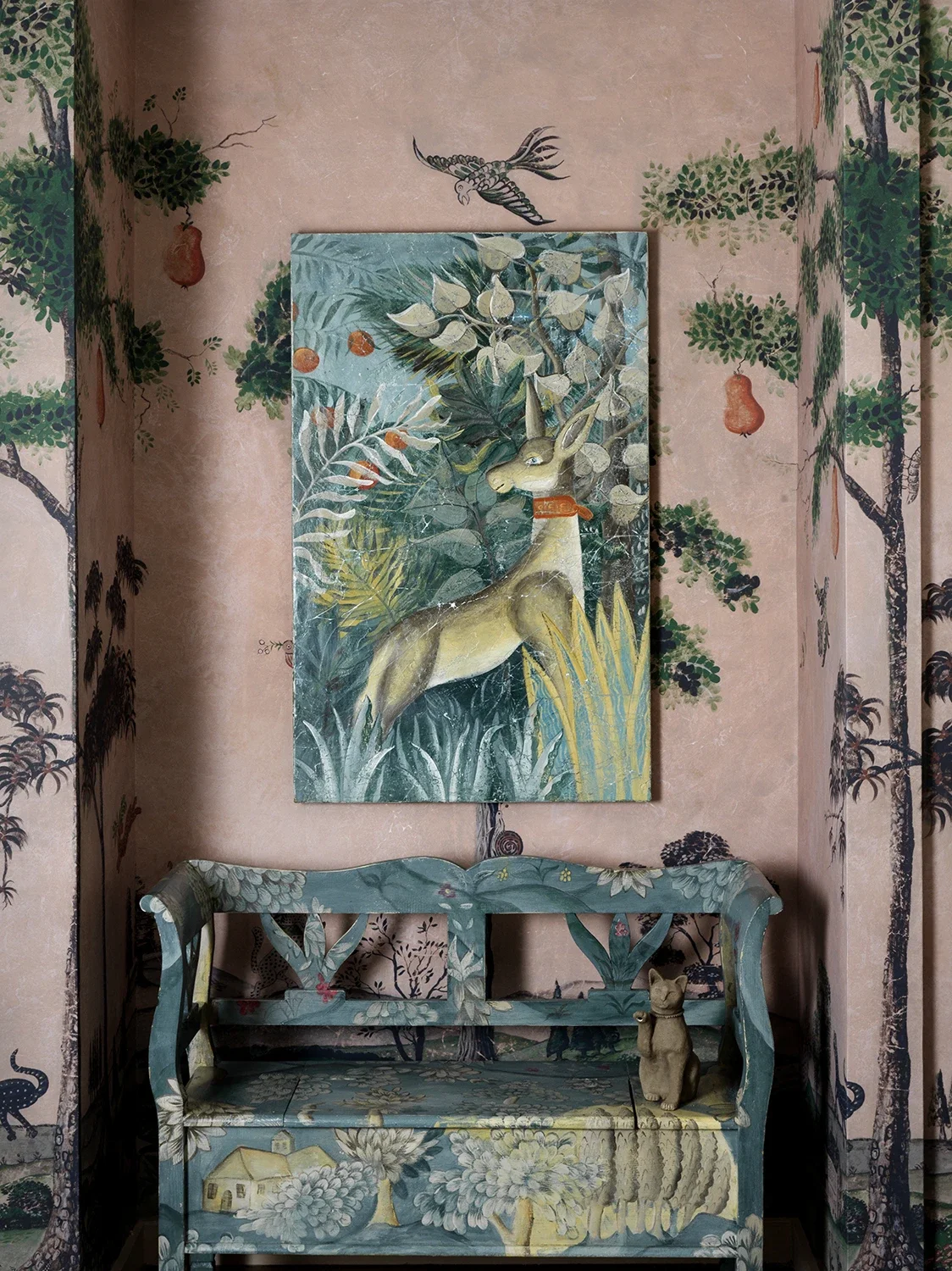 Kit Kemp's Drawing Room installation at Bergdorf Goodman, New York, 2019, featuring Melissa White's Mythical Land mural as backdrop, with hand-painted fresco secco panels, painted bench, and decorated chest.