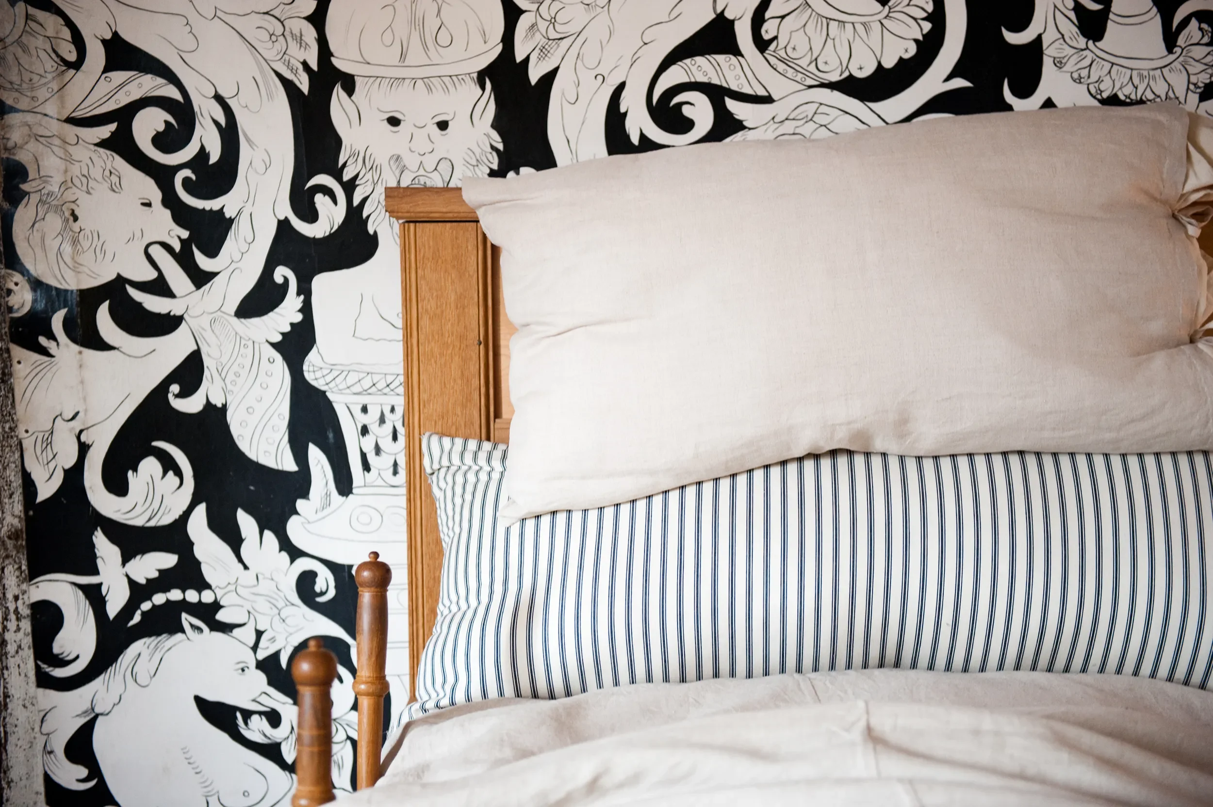 A close-up of bed set against painted cloths by Melissa White at Shakespeare's Birthplace Museum, Stratford-upon-Avon, 2000.