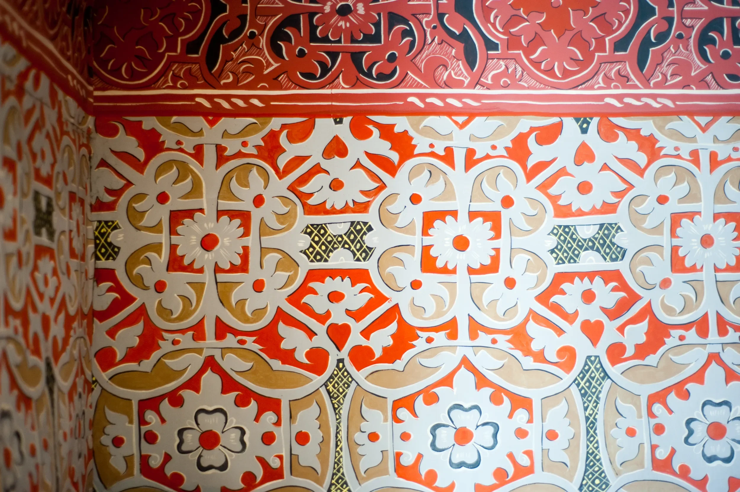Decorative pattern detail in red, white, black, beige, and yellow colours by Melissa White for Shakespeare's Birthplace Museum.
