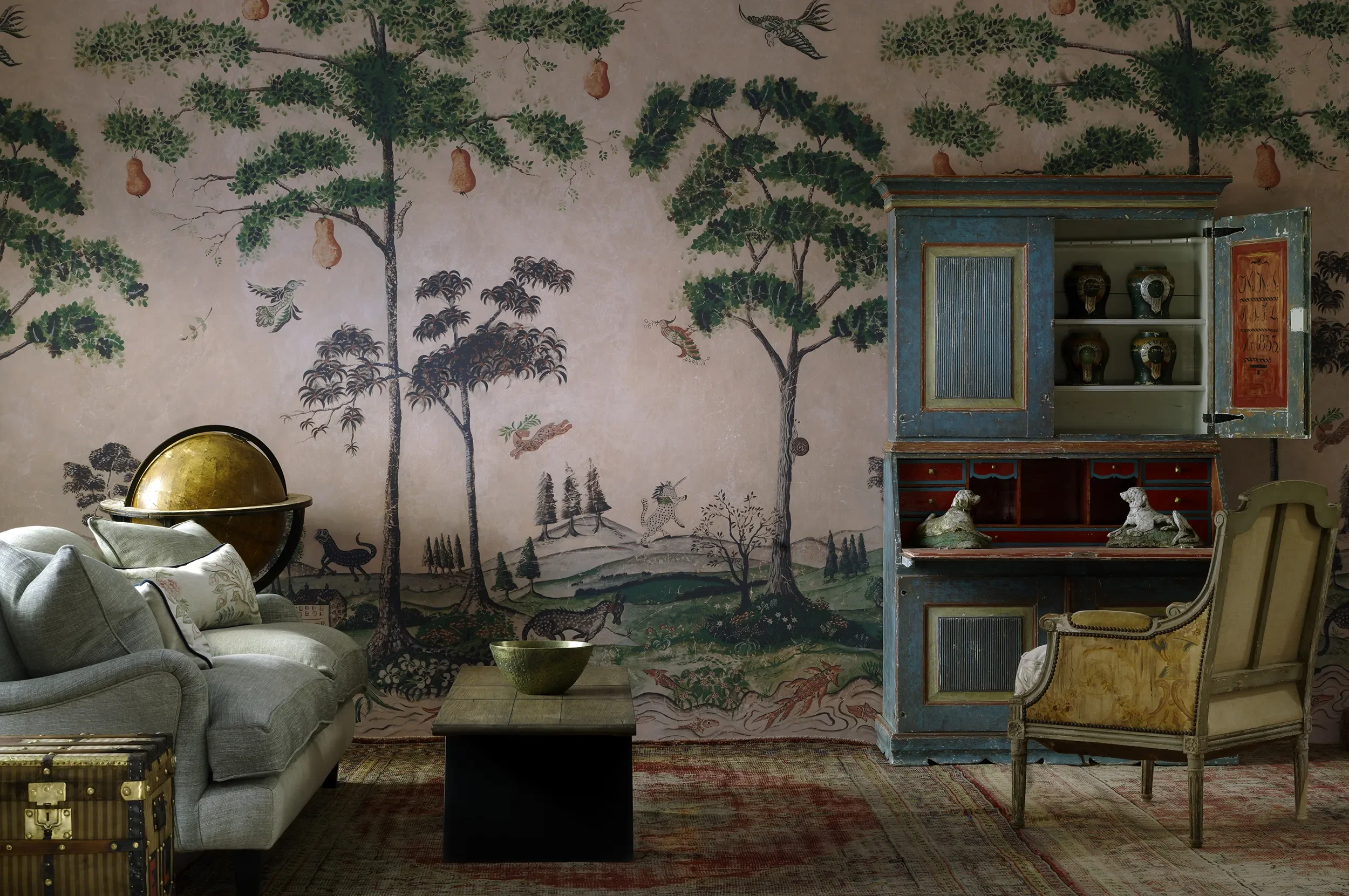 Photo shows the Firmdale Hotel for Kit Kemp project by Melissa White. Melissa's Mythical Land wallpaper is pictured with several vintage and antique items of furniture.
