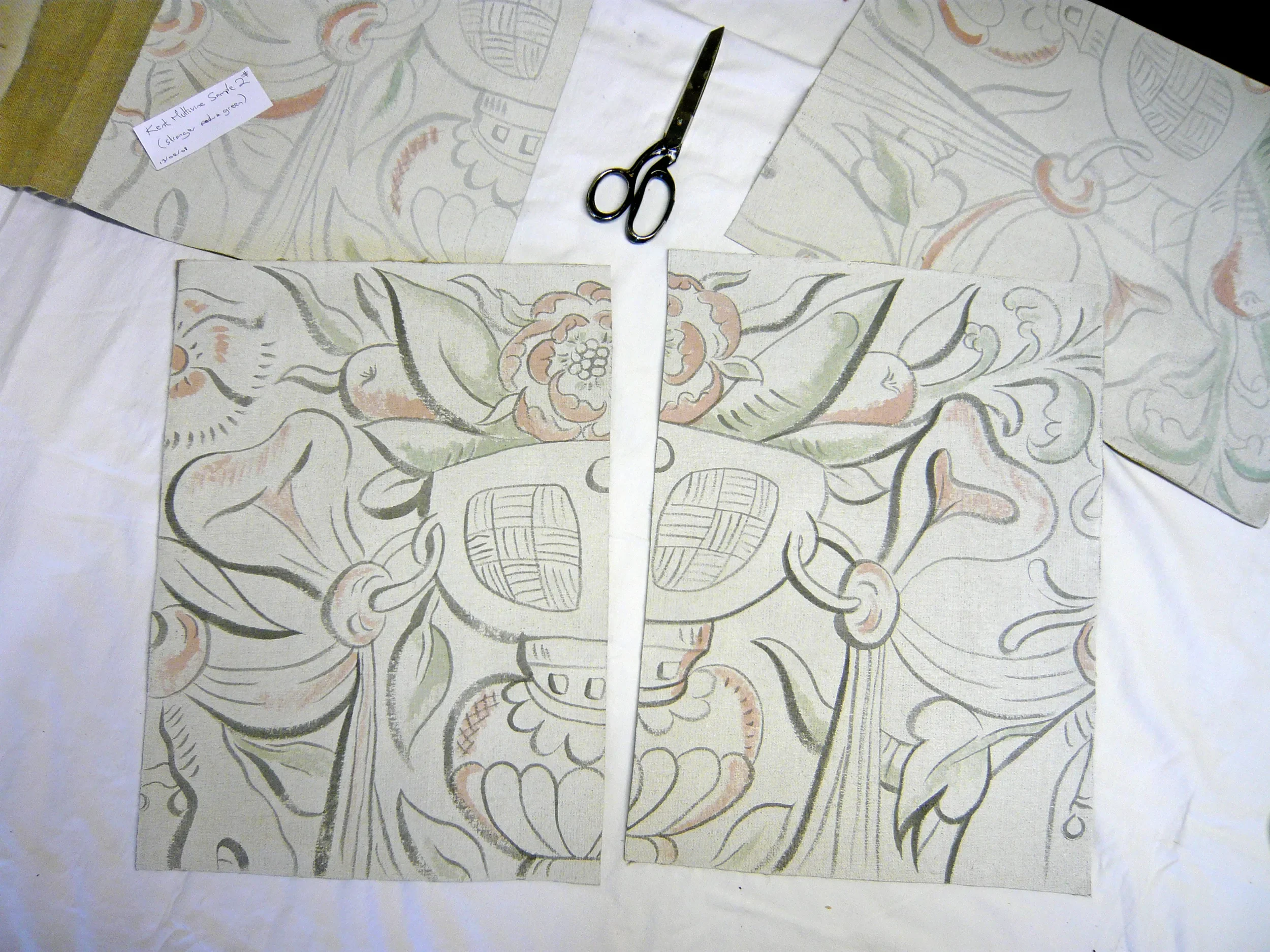 Coloured illustration on paper of a decorative floral pattern, with sections separated and scissors placed on top. Illustration is detail from Melissa White's largescale multivine painted cloths for Stiffkey Old Hall, Norfolk.