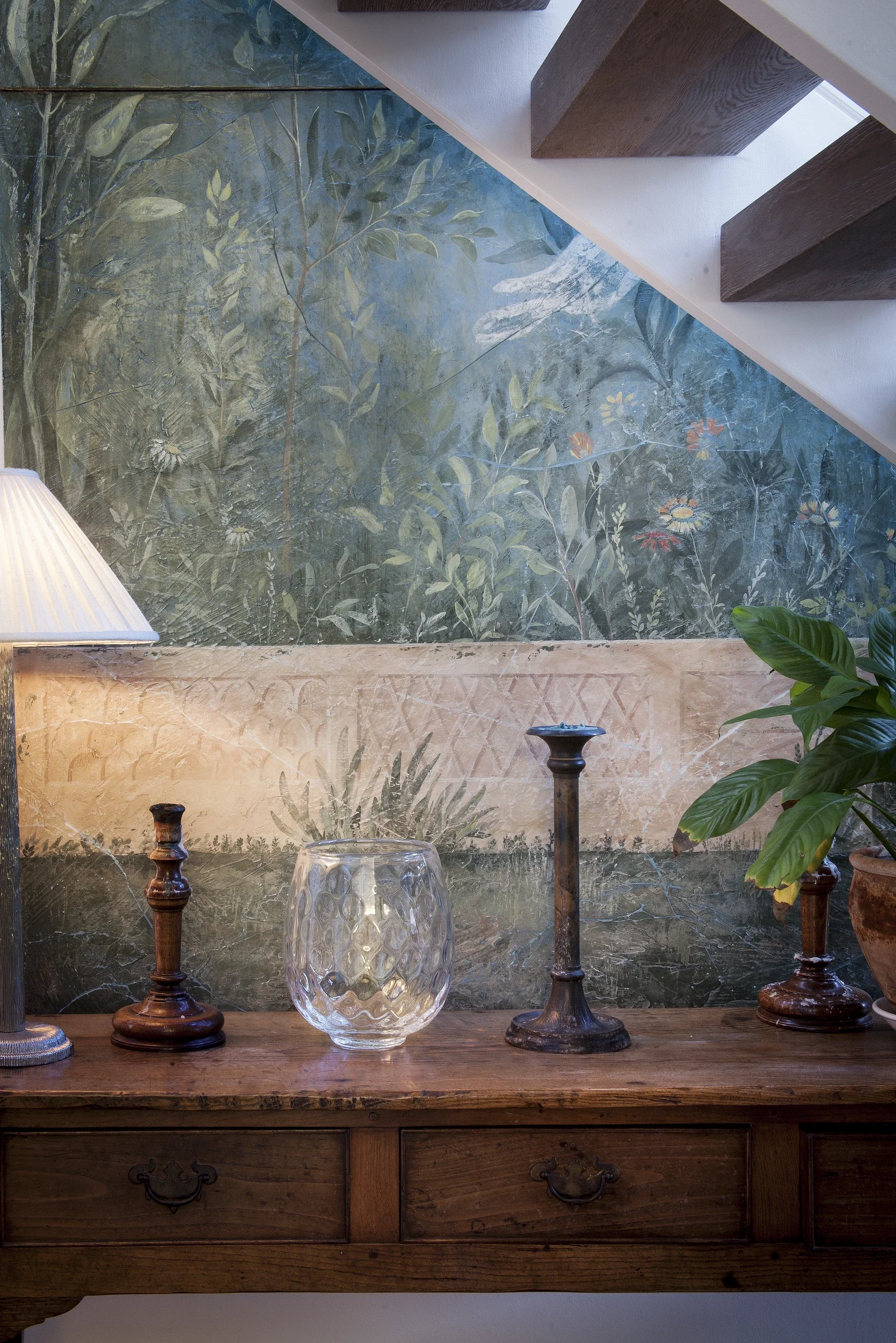 Melissa White's Villa of Livia fresco is pictured beneath some architectural stairs in the domestic setting.