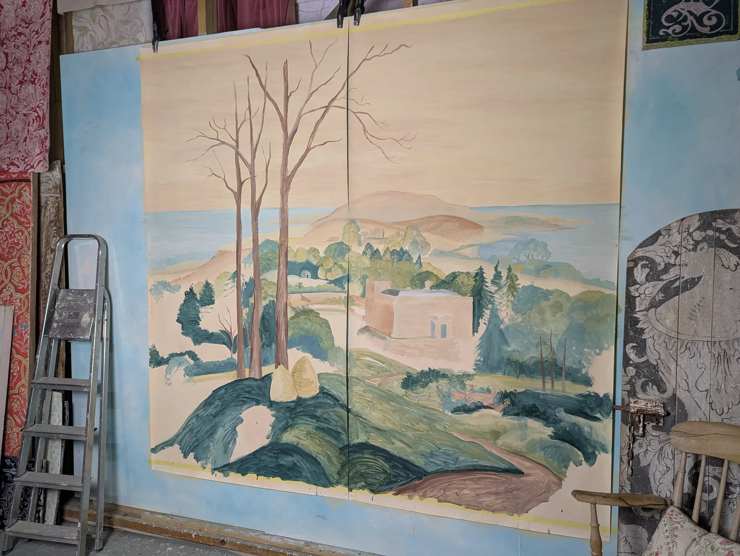 Eshott Hall scenic wallpaper by Melissa White, work in progress in the Hastings studio, 2026. Hand-painted Northumberland landscape for the second Wildhive Collection commission, shown on the studio floor during painting.