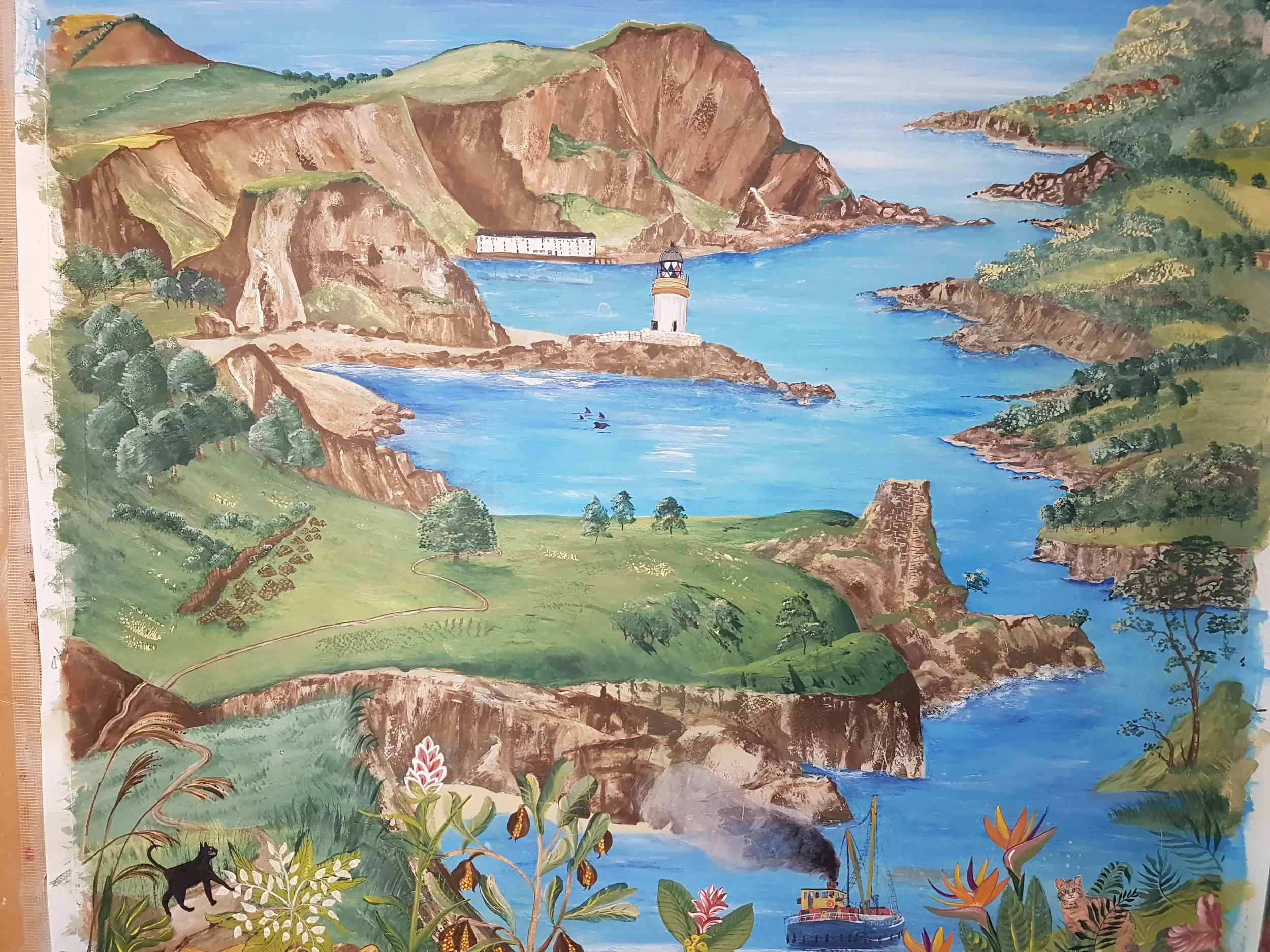 A colorful painted landscape featuring green hills, cliffs, and a body of water with a lighthouse and a boat, surrounded by trees and plants, including tropical flowers and a black panther.